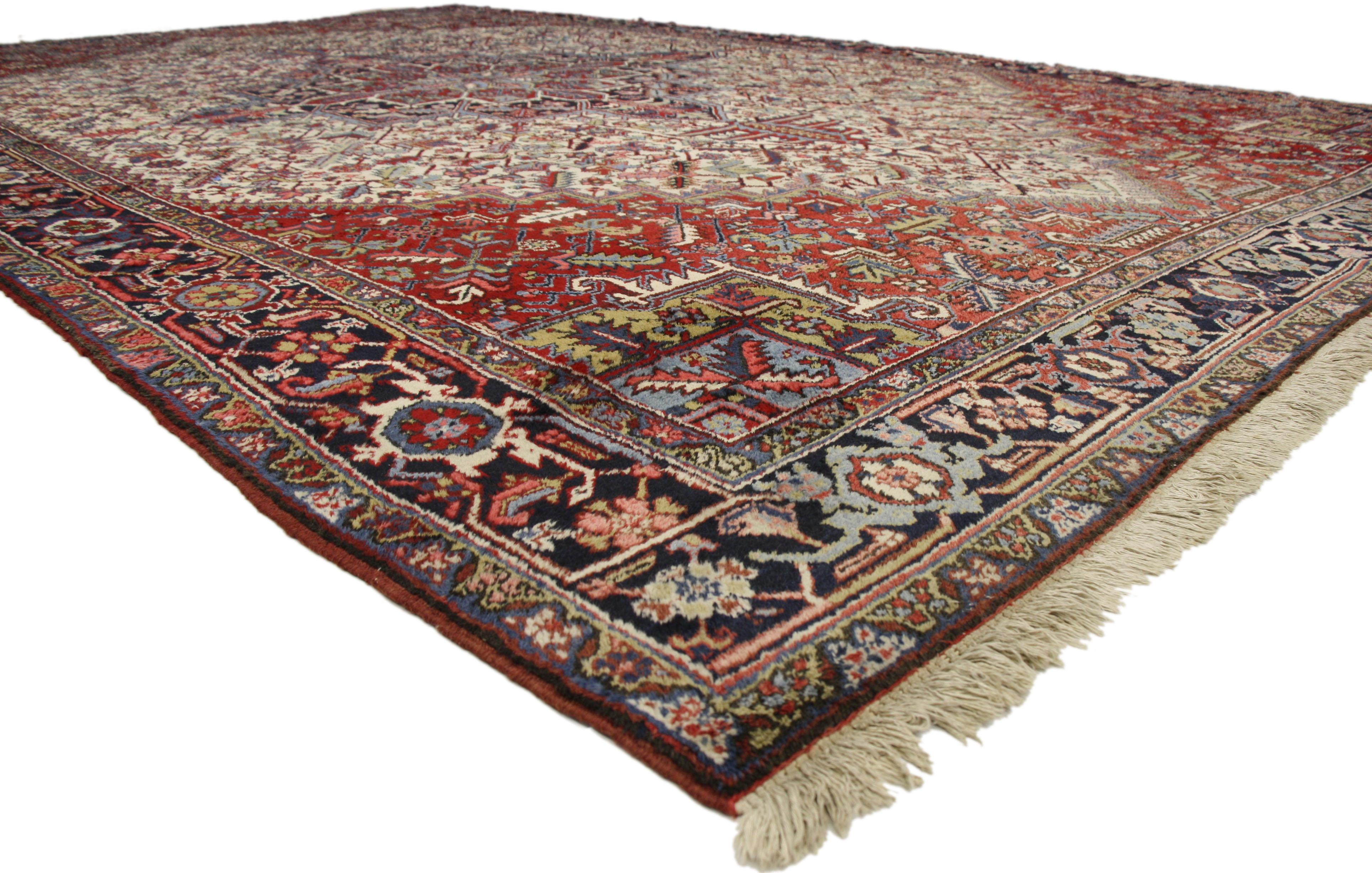 77175 Antique Persian Heriz Rug, 11'05 x 19'00.
Step into the world of elegance and sophistication with this exquisite hand knotted wool antique Persian Heriz rug. Its traditional and regal design is a true feast for the eyes, boasting brilliant