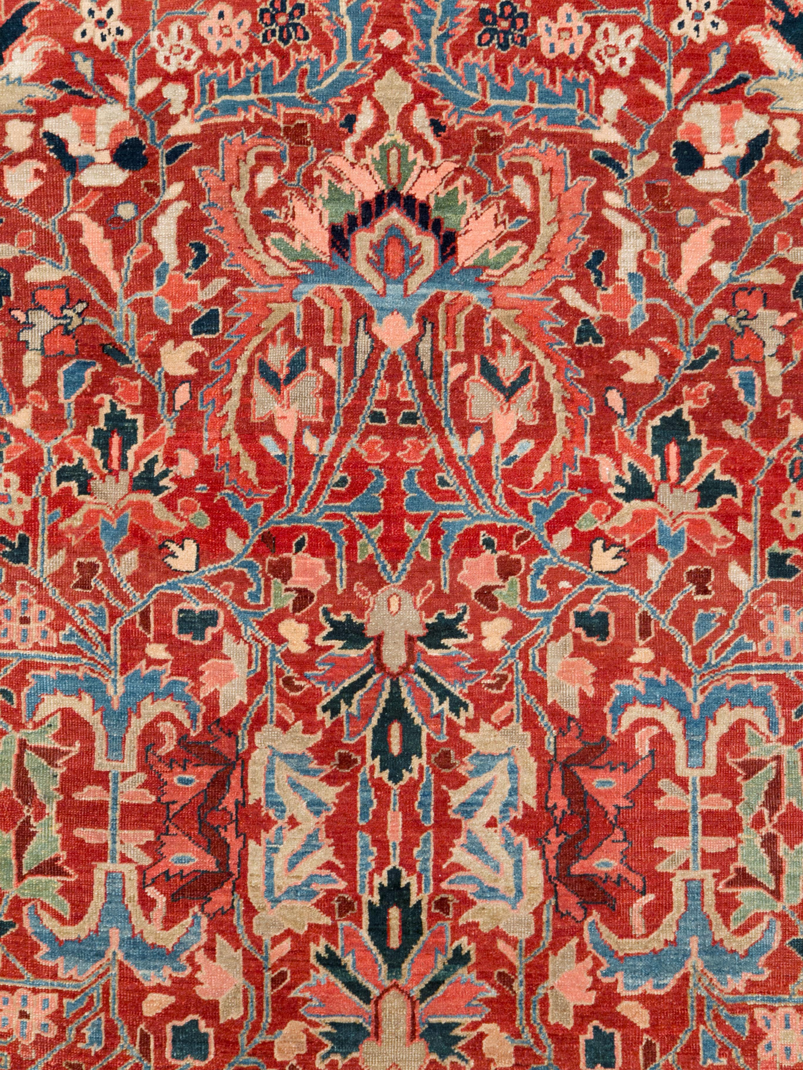 An antique Persian Heriz carpet from the early 20th century.