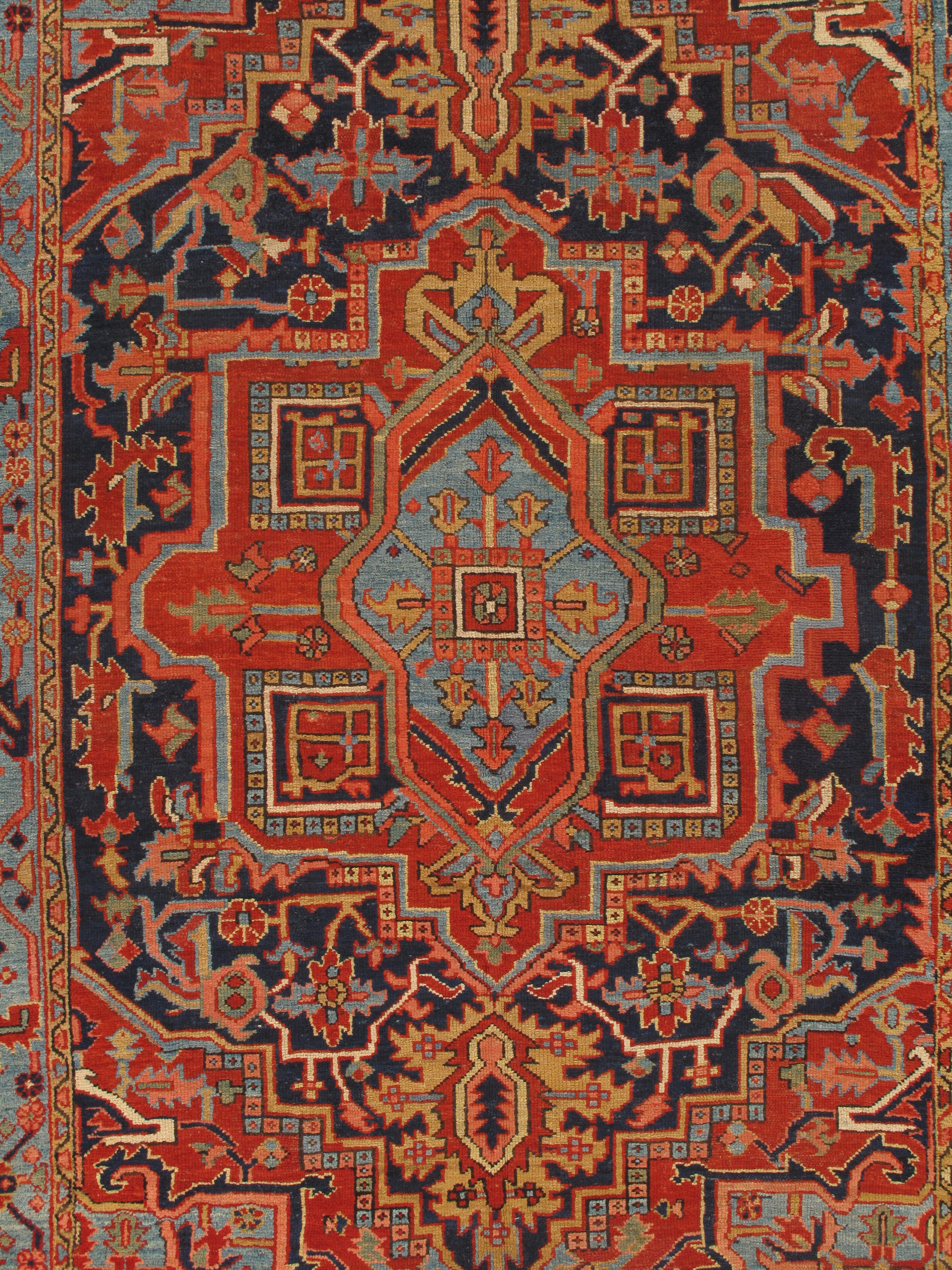 Early 20th-century Heriz/Serapi rugs represent a pinnacle of artistic achievement in Persian carpet weaving. Originating from the Serab village in the Heriz region of Northwest Persia (now Iran), these rugs are renowned for their bold, geometric