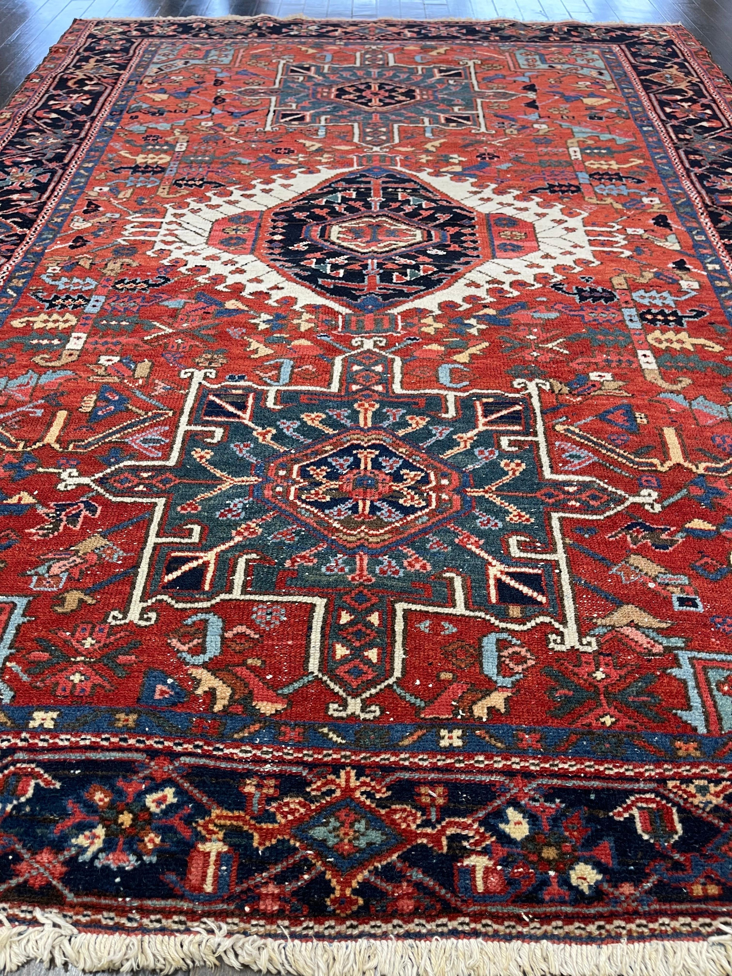 Hand knotted in wool, this carpet was made in the town of Heriz located northwest of Iran. Heriz carpet structure consists of a single cotton warp and double cotton weft using Turkish knots.

The rust/brown field is decorated with a medallion