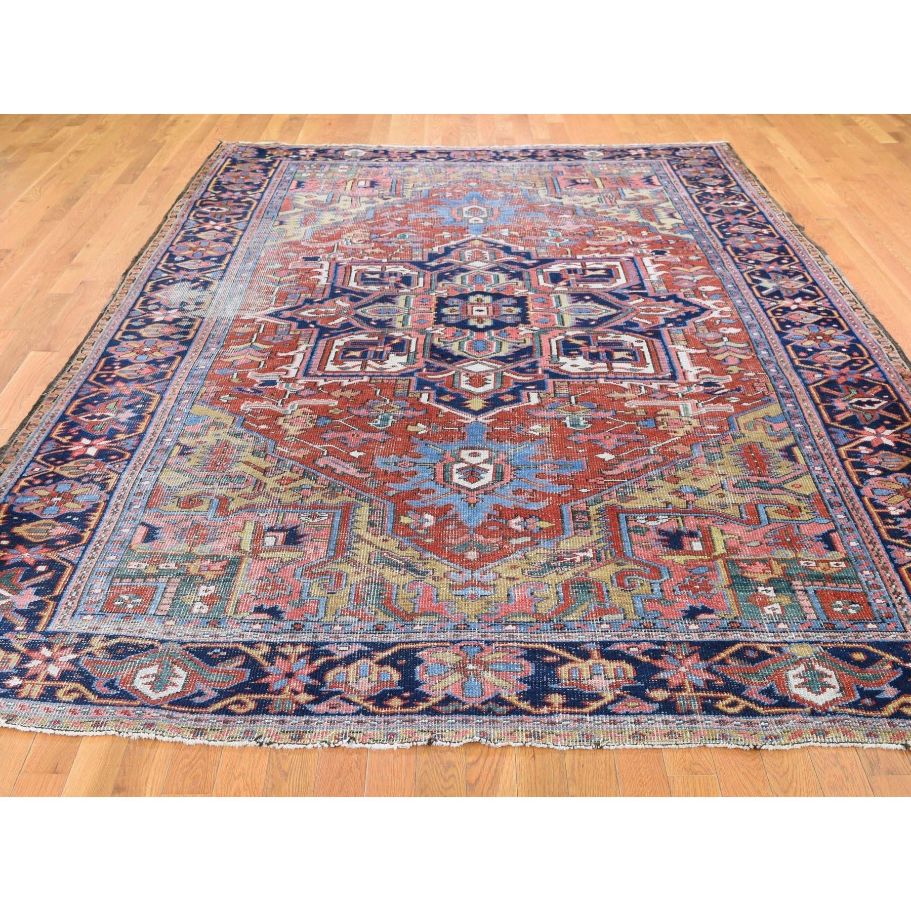 This is a truly genuine one-of-a-kind antique Persian Heriz clean worn but no holes hand knotted rug. It has been knotted for months and months in the centuries-old Persian weaving craftsmanship techniques by expert artisans. Measures: 7'9