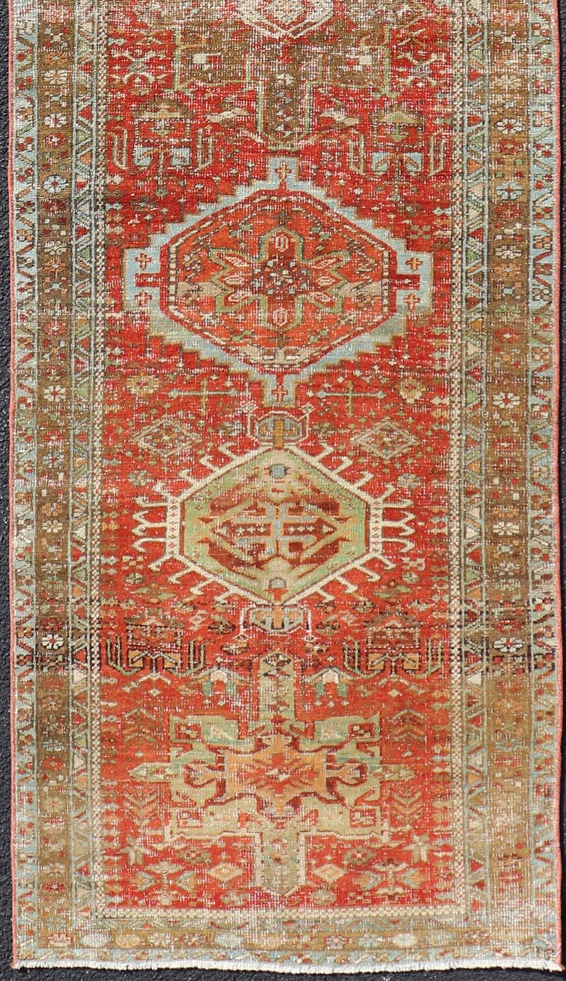 Antique Persian Heriz Distressed Runner with Geometric Medallions in Soft Colors In Good Condition For Sale In Atlanta, GA