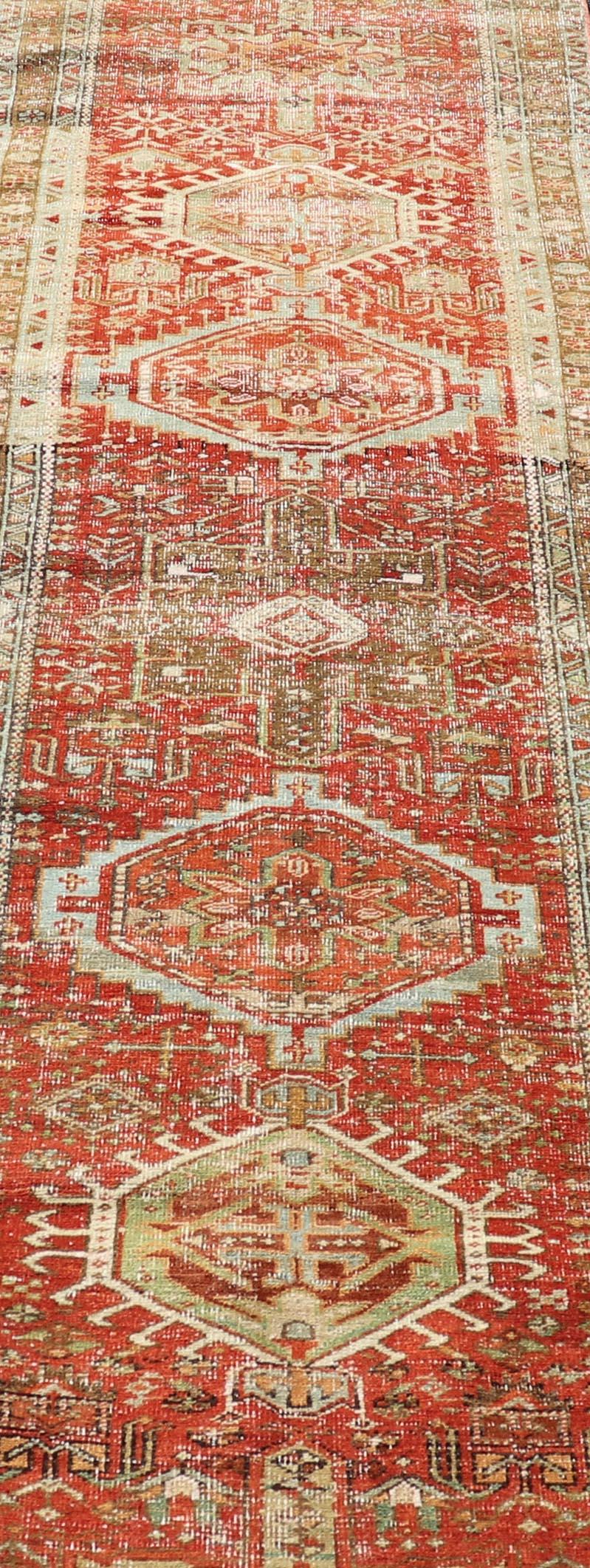 Antique Persian Heriz Distressed Runner with Geometric Medallions in Soft Colors For Sale 1