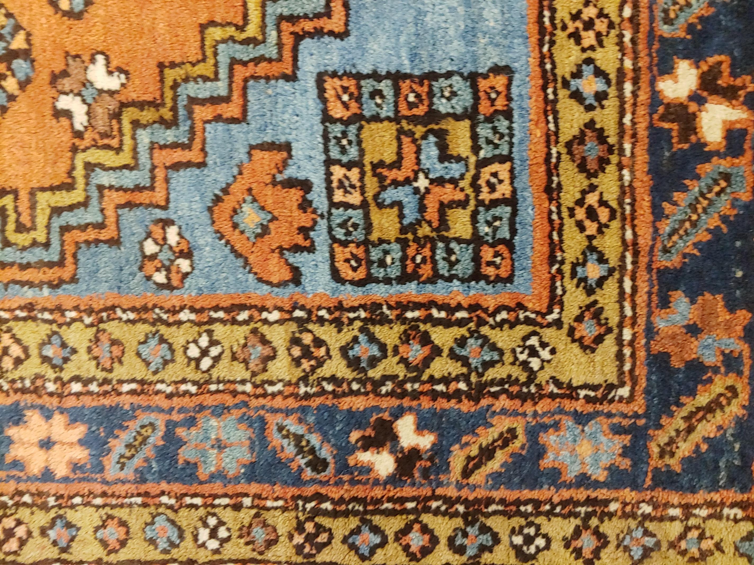 Asian Antique Persian Heriz, Geometric Design, Rust with Blue Wool, 1915 For Sale