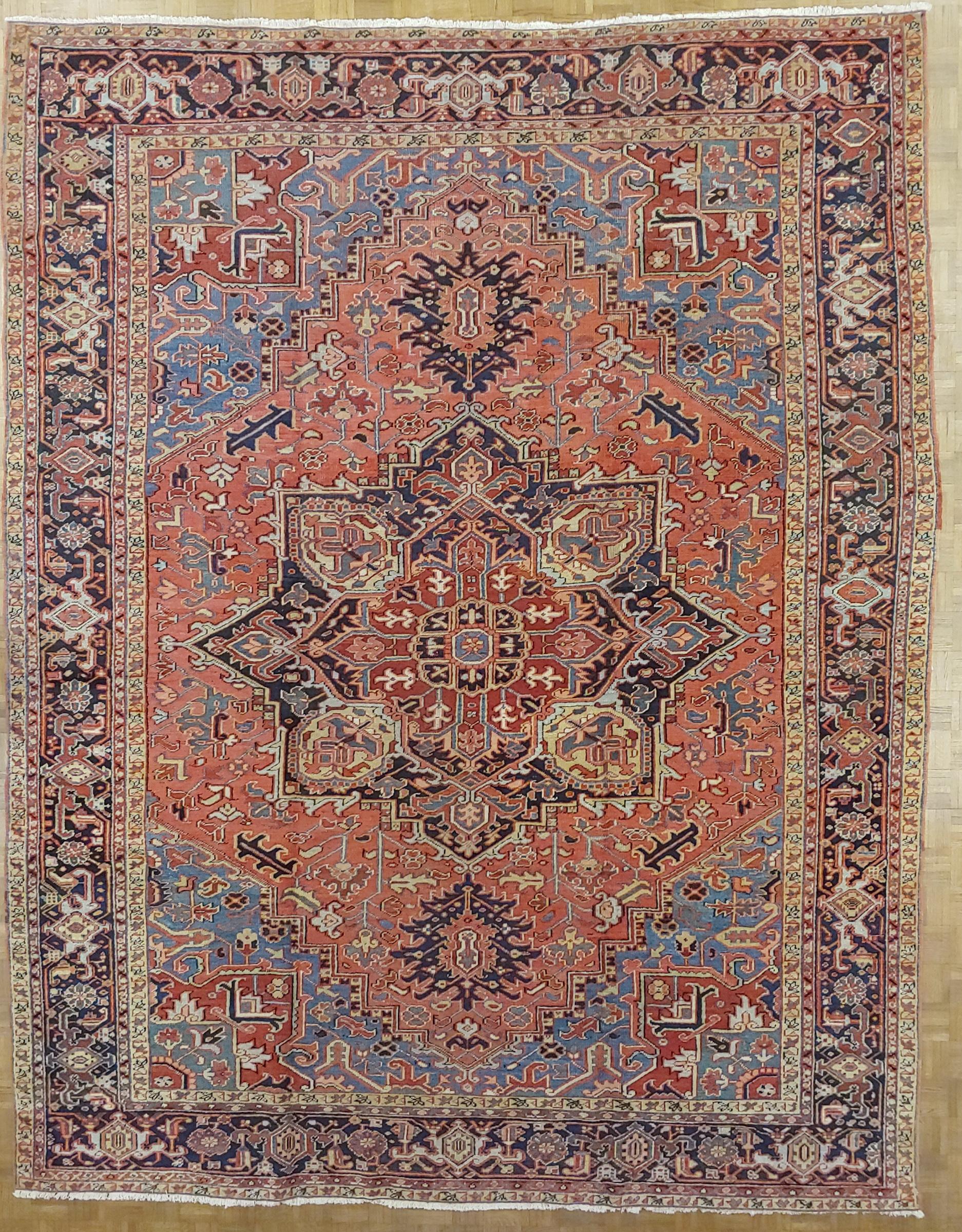 20th Century Antique Persian Heriz Rug, Coral Field Light Blue Corners, Wool, 1915 For Sale