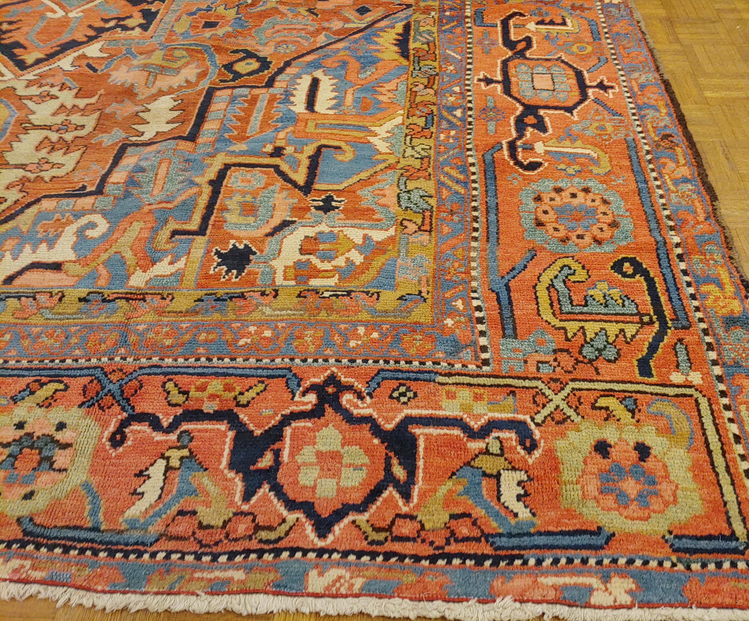 This is a gracious and beautiful Persian Heriz (though lots of dealers would call it a Serapi. The field is rust with light blue spandrels and a wonderful Herati motif border with coral background. It is almost 10 x 14 and is from 1915.