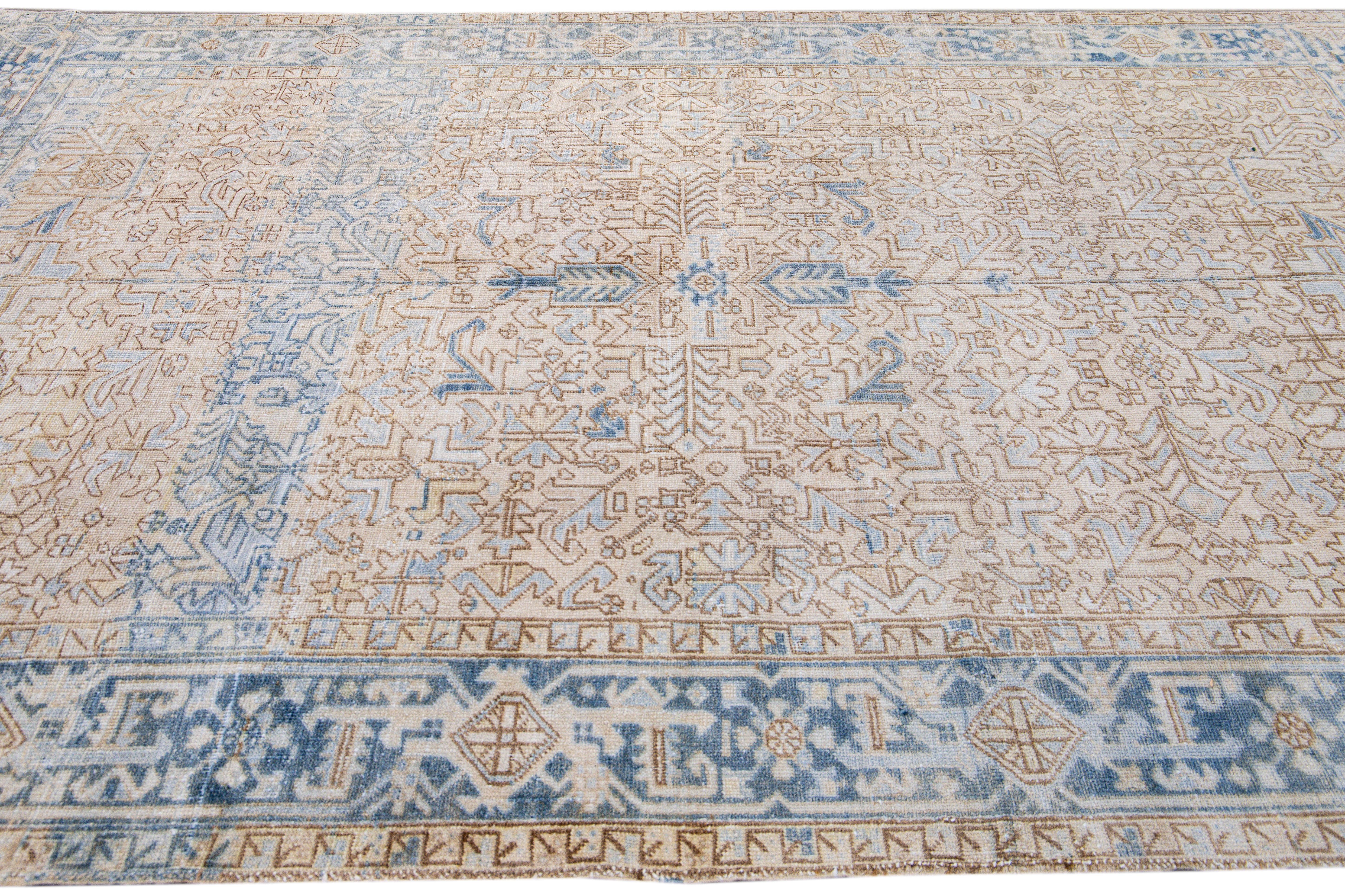 Early 20th Century Antique Persian Heriz Handmade Allover Geometric Beige And Blue Wool Rug For Sale