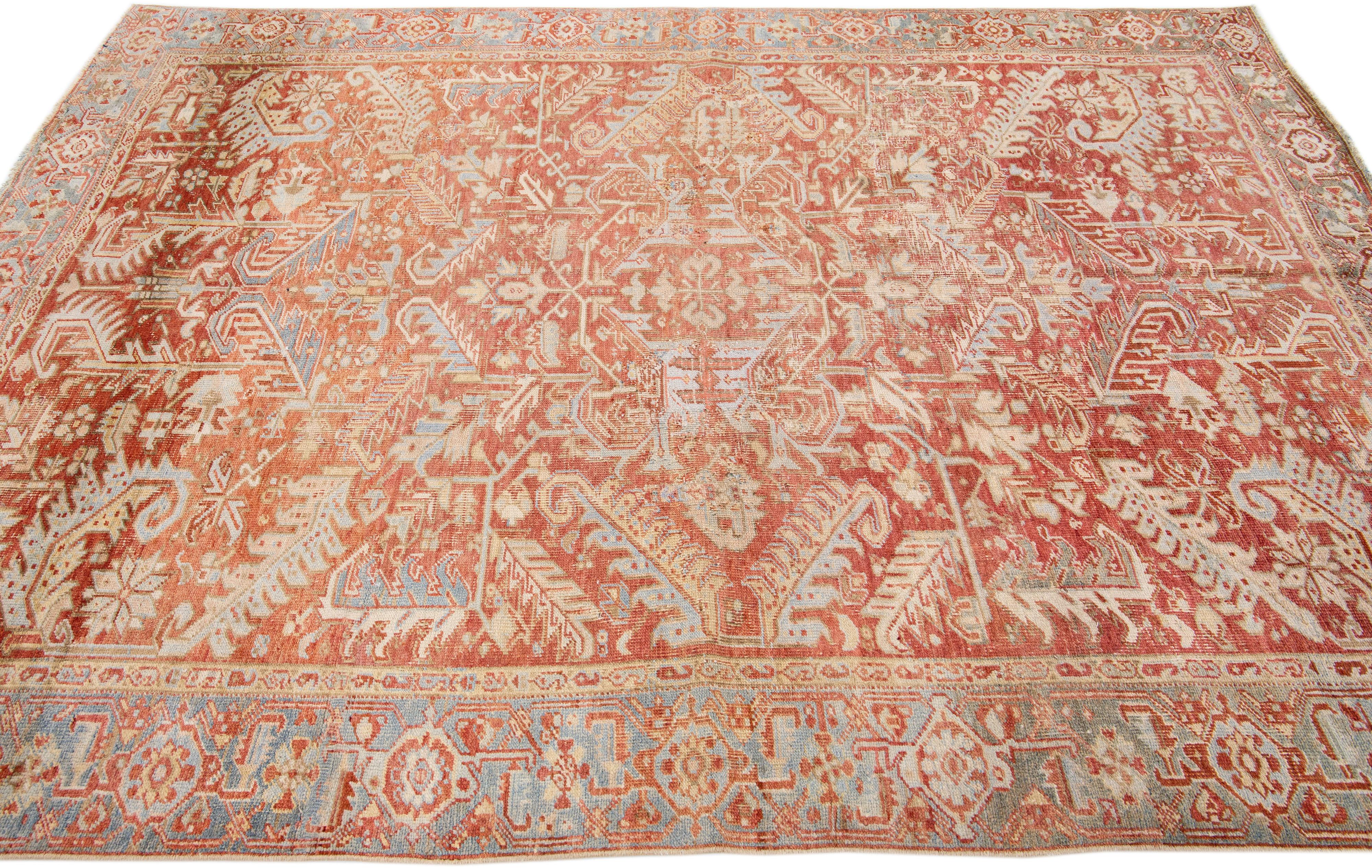 Early 20th Century Antique Persian Heriz Handmade Allover Motif Rust & Blue Wool Rug For Sale