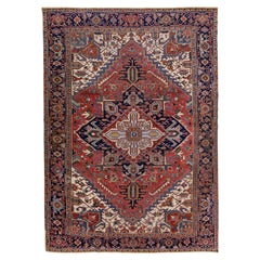 Tapis persan ancien Heriz en laine fait à la main à motif de médaillons