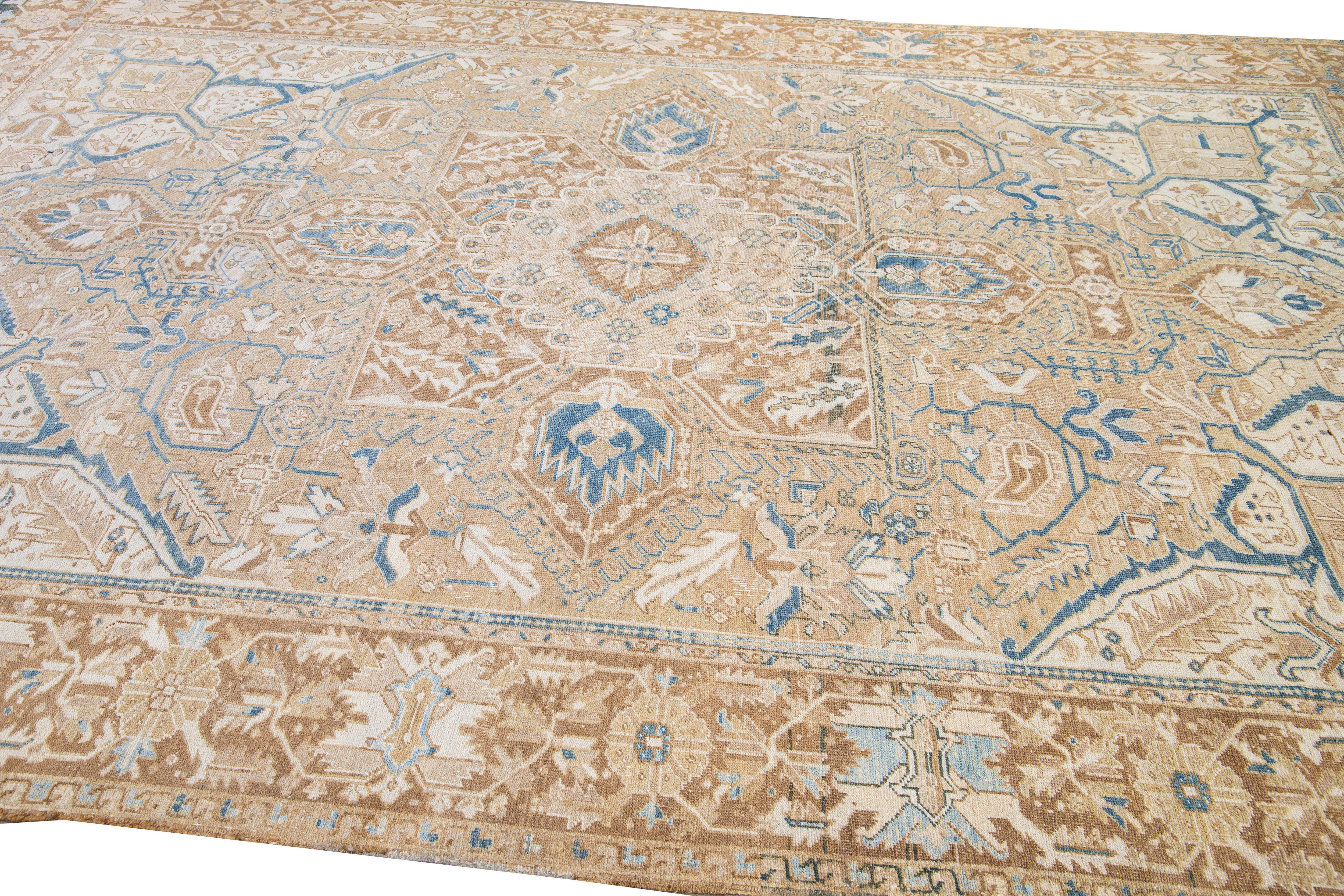 Early 20th Century Antique Persian Heriz Handmade Medallion Tan and Blue Wool Rug For Sale