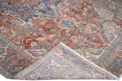 Antique Persian Heriz Handmade Red and Blue Medallion Floral Wool Rug