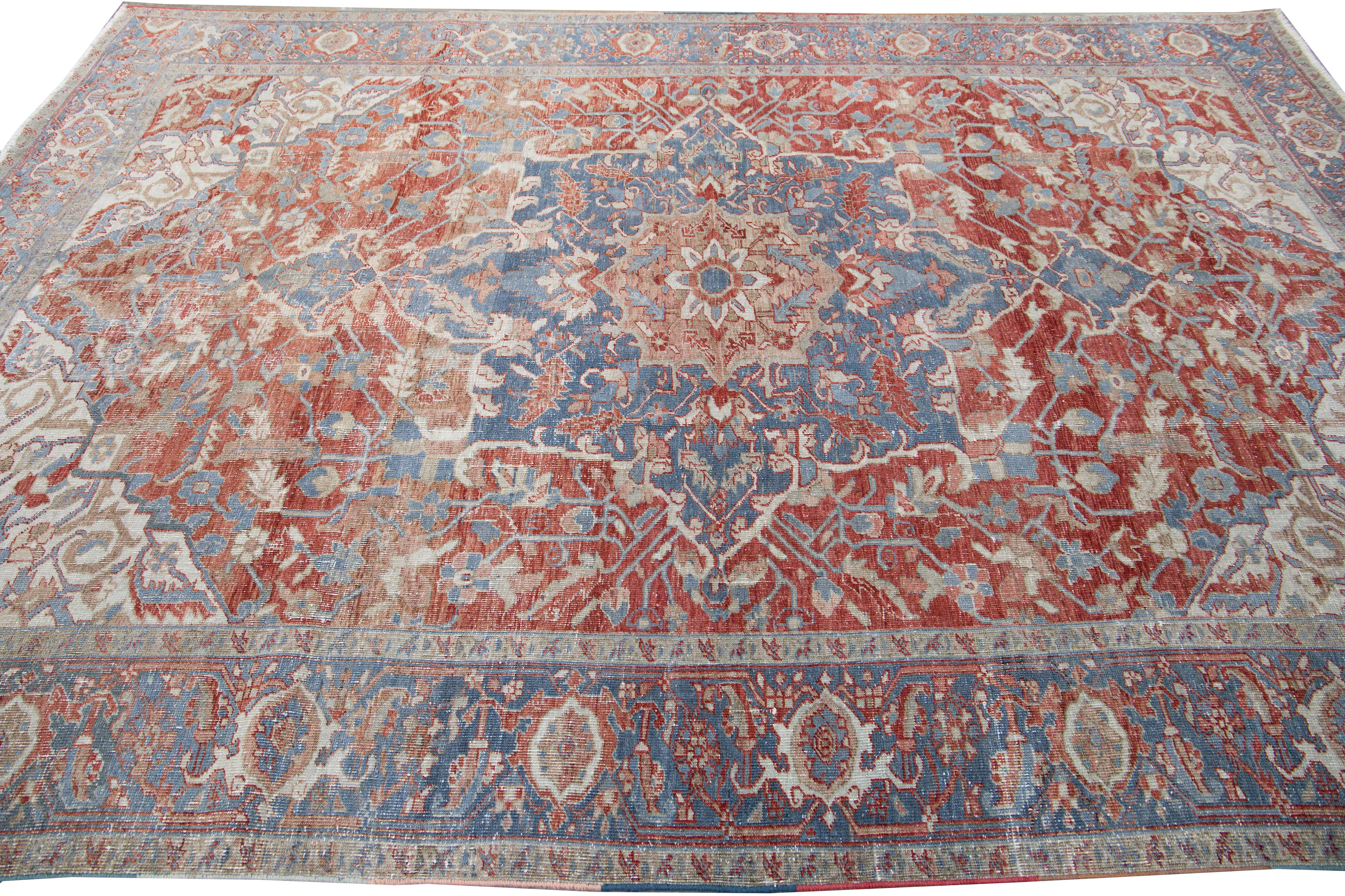 Early 20th Century Antique Persian Heriz Handmade Red and Blue Medallion Floral Wool Rug For Sale