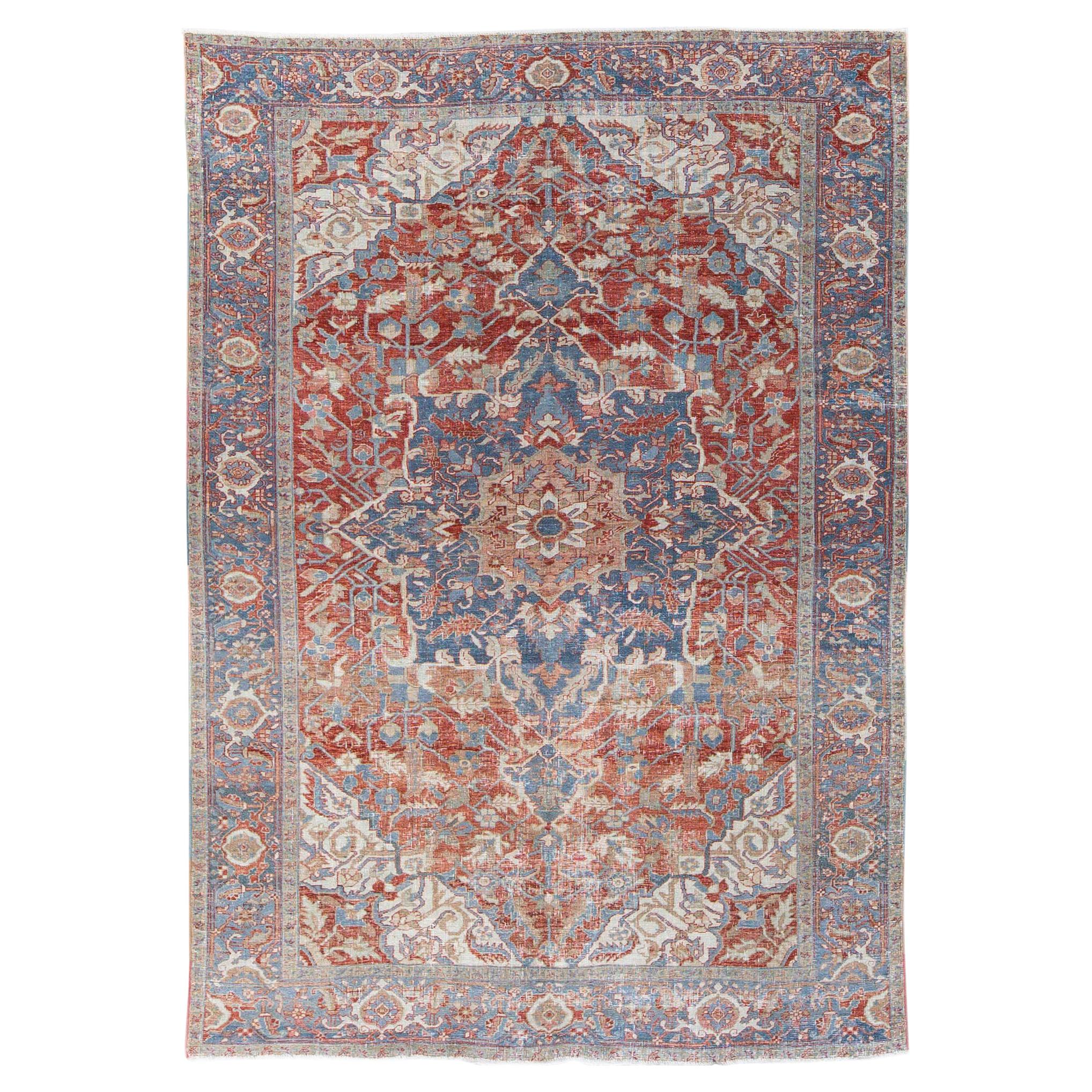 Antique Persian Heriz Handmade Red and Blue Medallion Floral Wool Rug For Sale