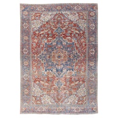 Antique Persian Heriz Handmade Red and Blue Medallion Floral Wool Rug