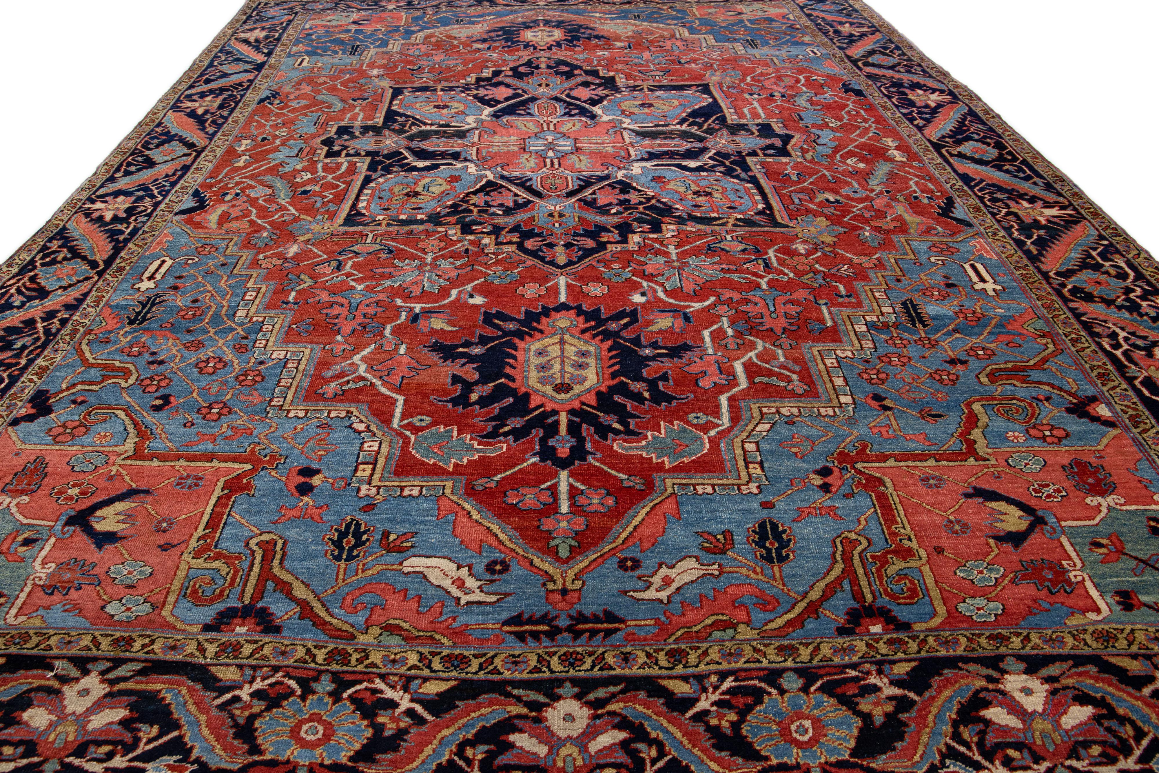 Heriz Serapi Antique Persian Heriz Handmade Red & Blue Wool Rug with Medallion Design For Sale