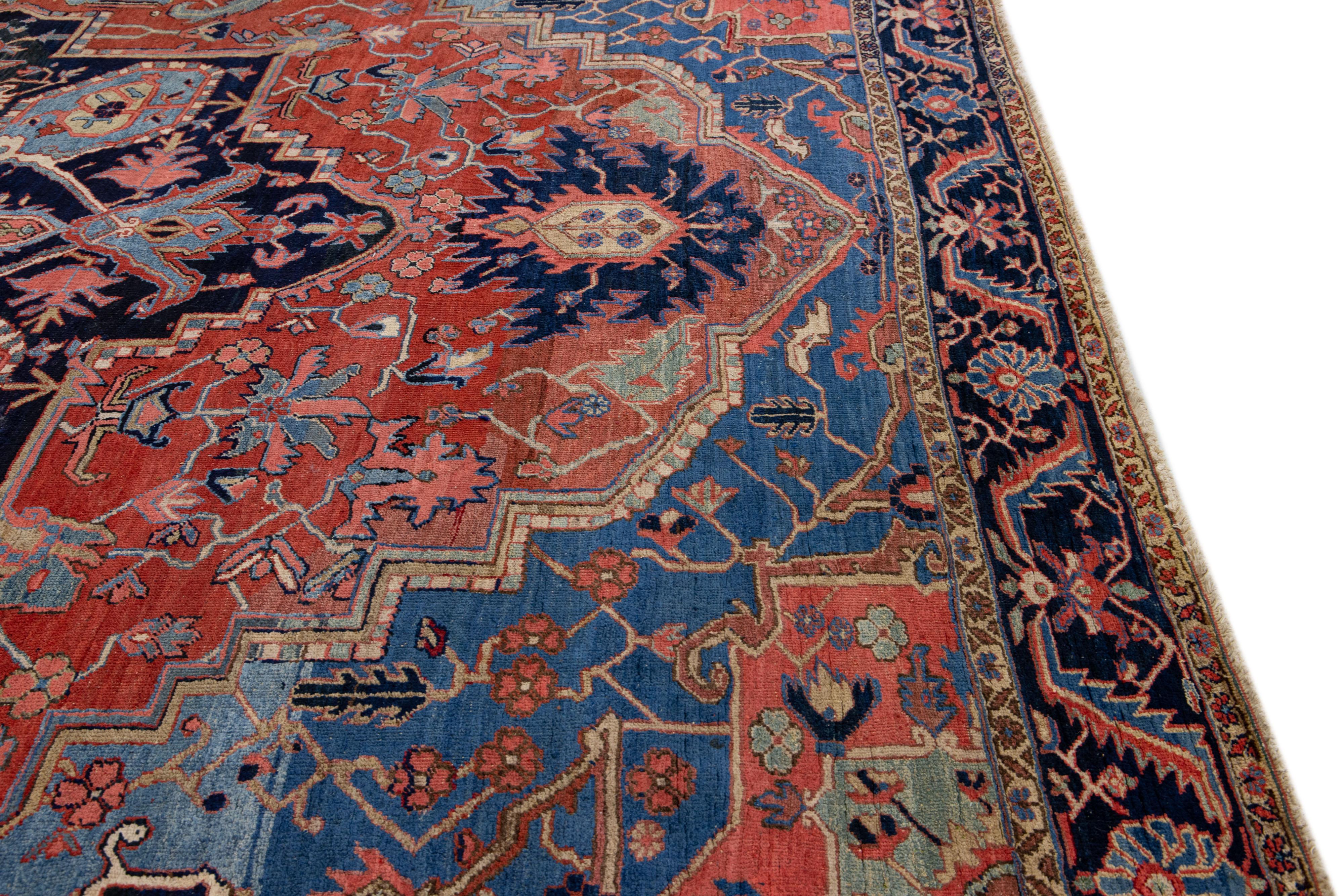 Antique Persian Heriz Handmade Red & Blue Wool Rug with Medallion Design For Sale 1