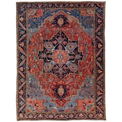 Tapis persan ancien Heriz en laine rouge et bleue fait à la main avec motif de médaillon