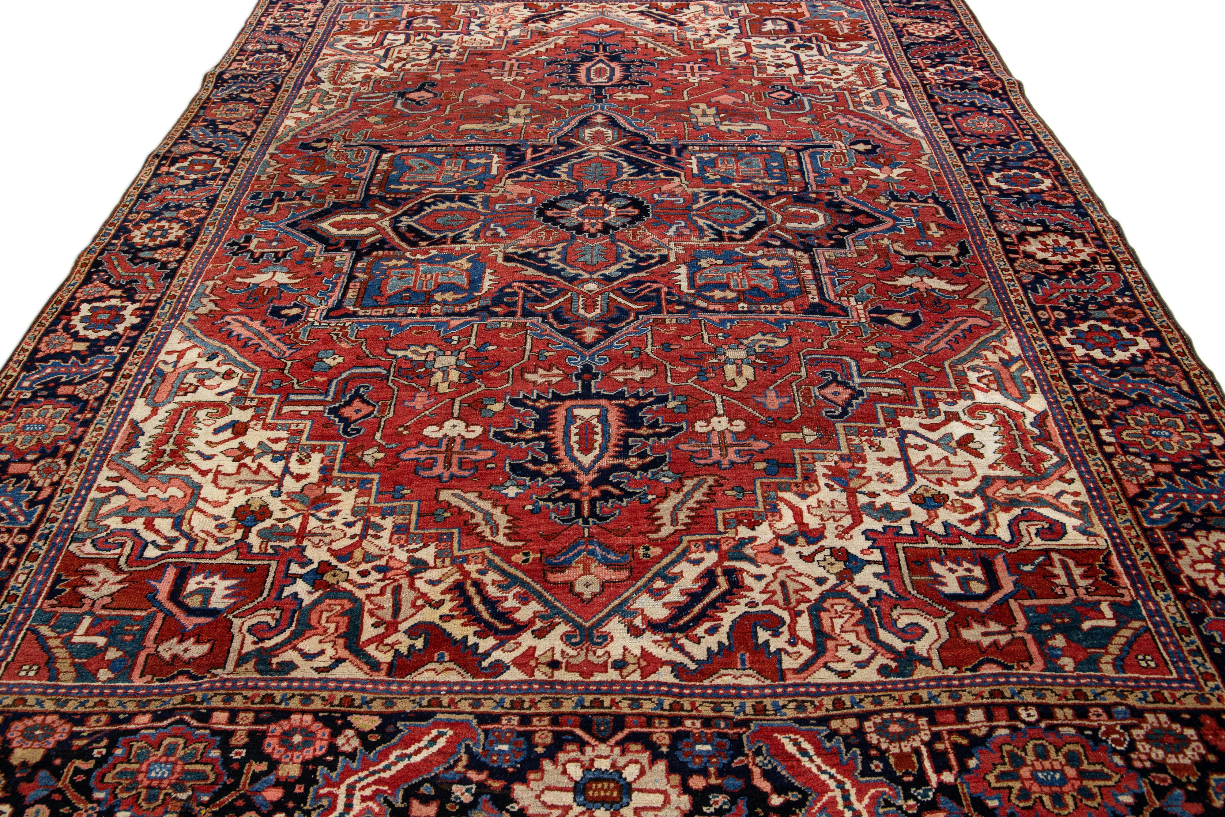 Heriz Serapi Antique Persian Heriz Handmade Red Wool Rug with Medallion Motif For Sale