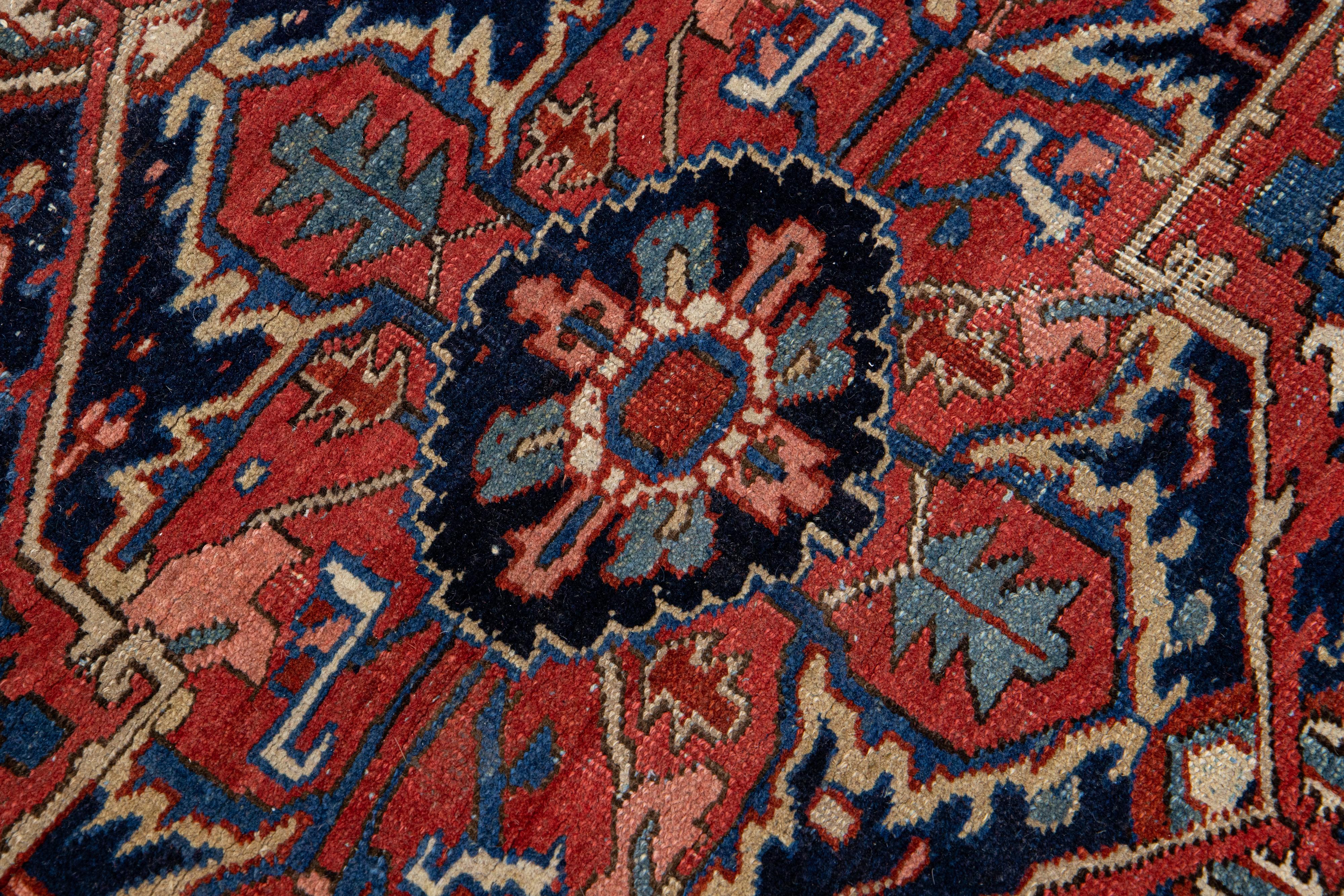 Antique Persian Heriz Handmade Red Wool Rug with Medallion Motif For Sale 1