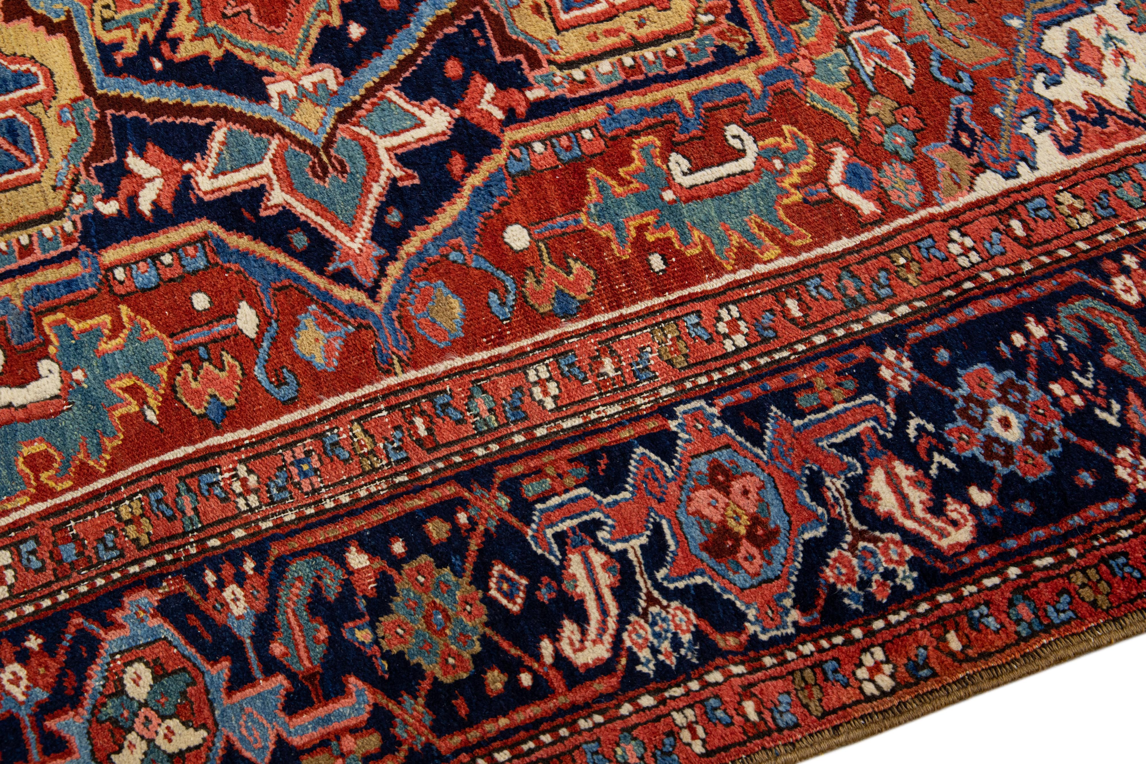 20th Century Antique Persian Heriz Handmade Wool Rug with Multicolor Medallion Design For Sale