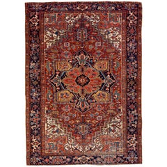 Tapis persan ancien Heriz en laine fait à la main avec motif de médaillon multicolore