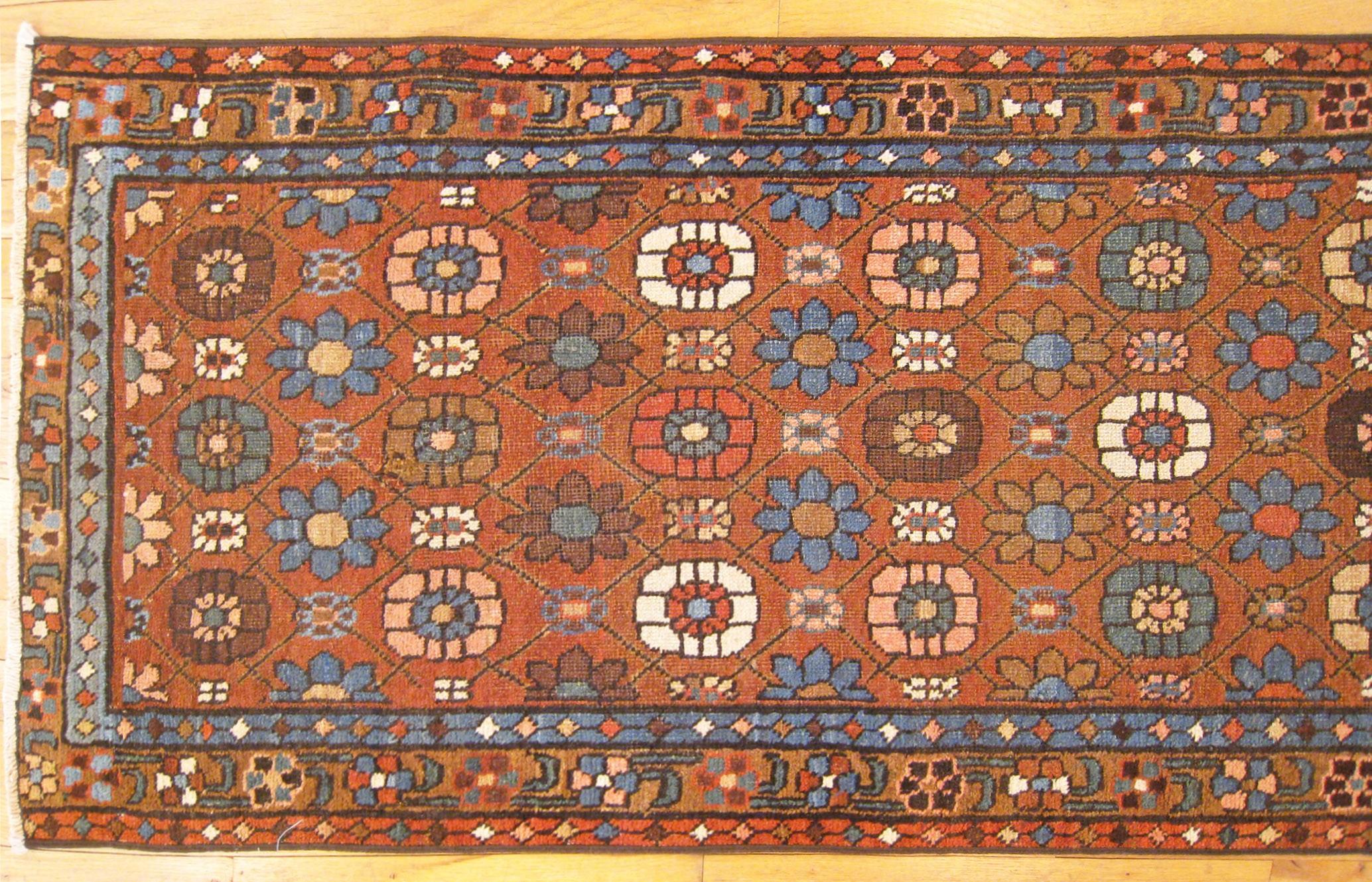 Early 20th Century Antique Persian Heriz Oriental Rug, in Runner size, Repeating Flower Head Design For Sale