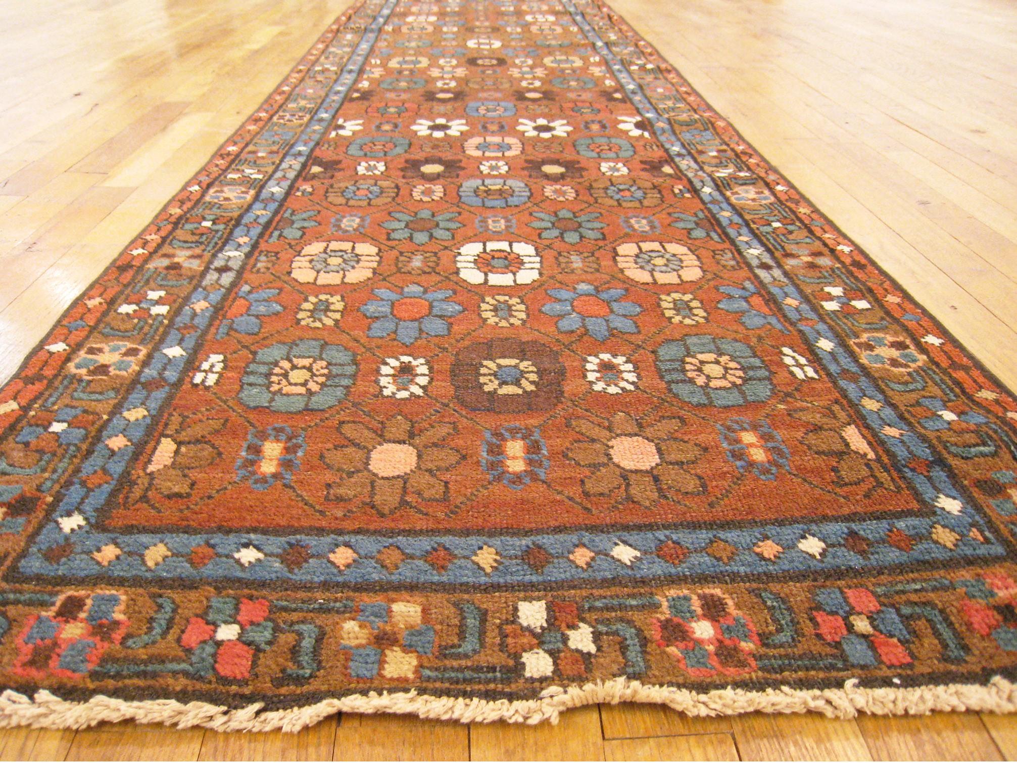 Wool Antique Persian Heriz Oriental Rug, in Runner size, Repeating Flower Head Design For Sale