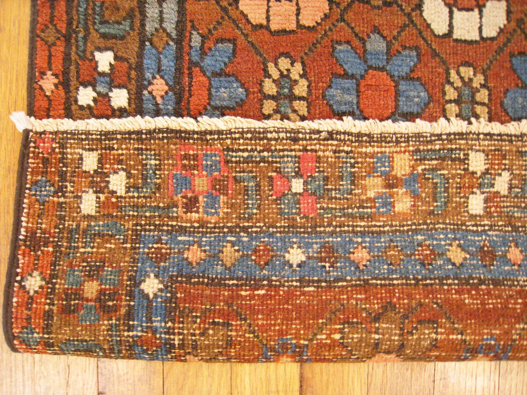 Antique Persian Heriz Oriental Rug, in Runner size, Repeating Flower Head Design For Sale 1