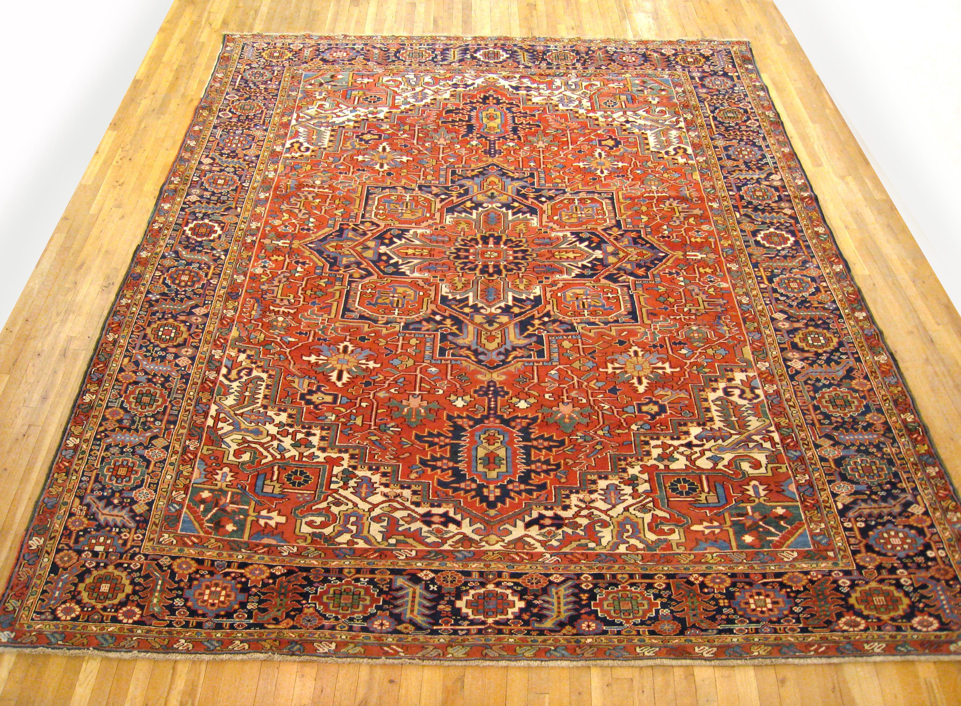 Antique Persian Heriz Oriental rug, Room size

An antique Persian Heriz oriental rug, size 13'1
