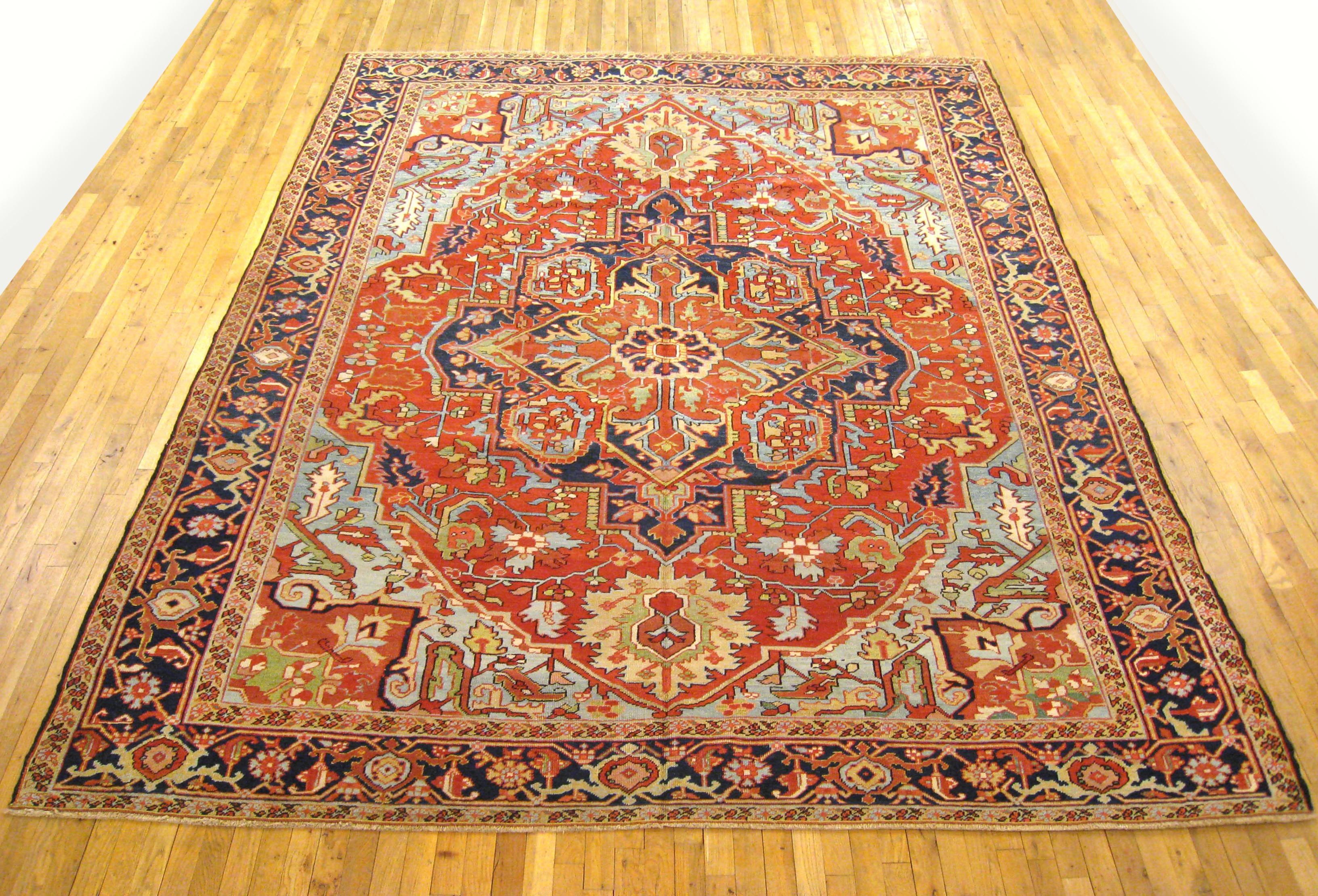 Antique Persian Heriz Oriental rug, Room size

An antique Persian Heriz oriental rug, size 11'2