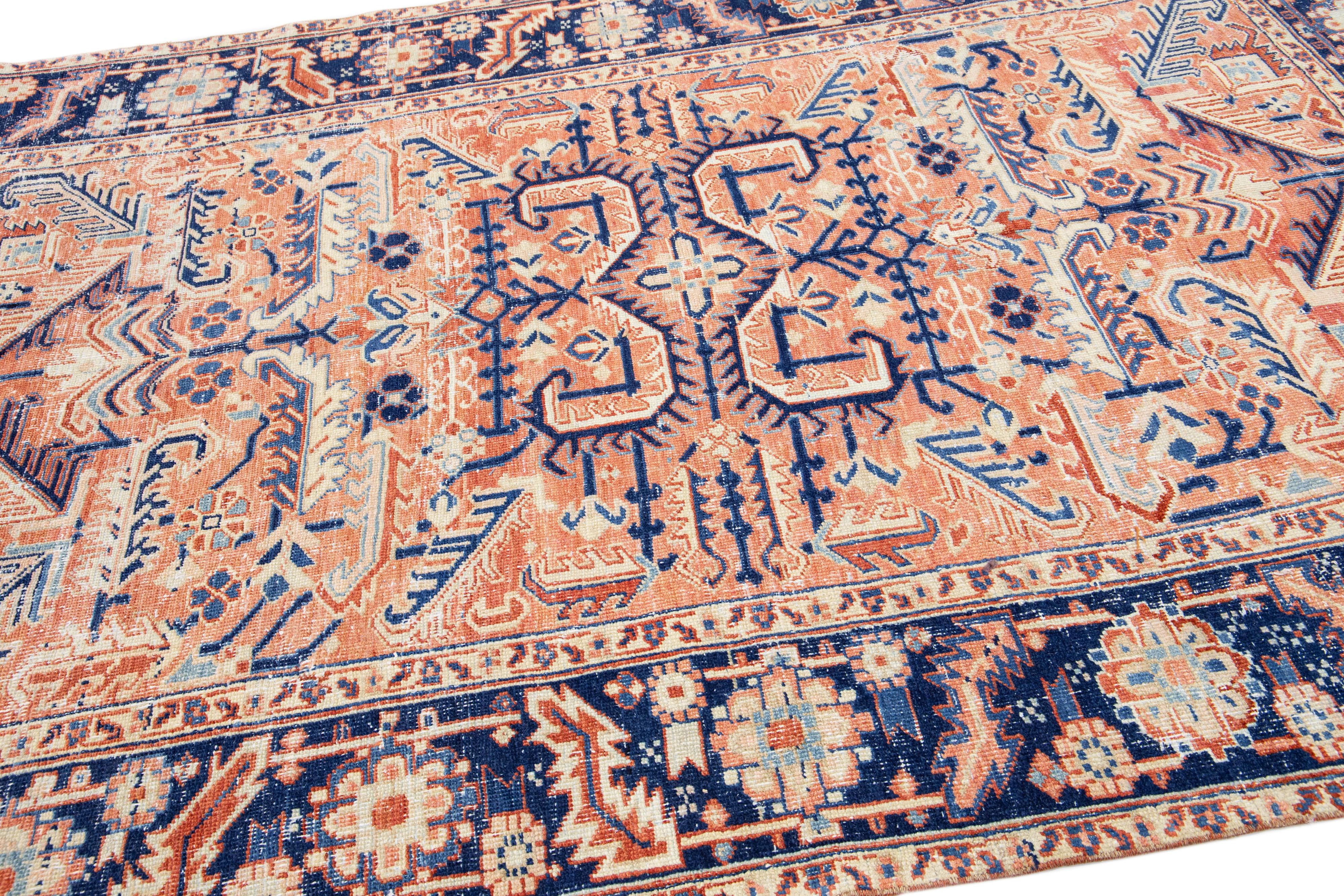 Hand-Knotted Antique Persian Heriz Peach Handmade Wool Rug with Medallion Design For Sale