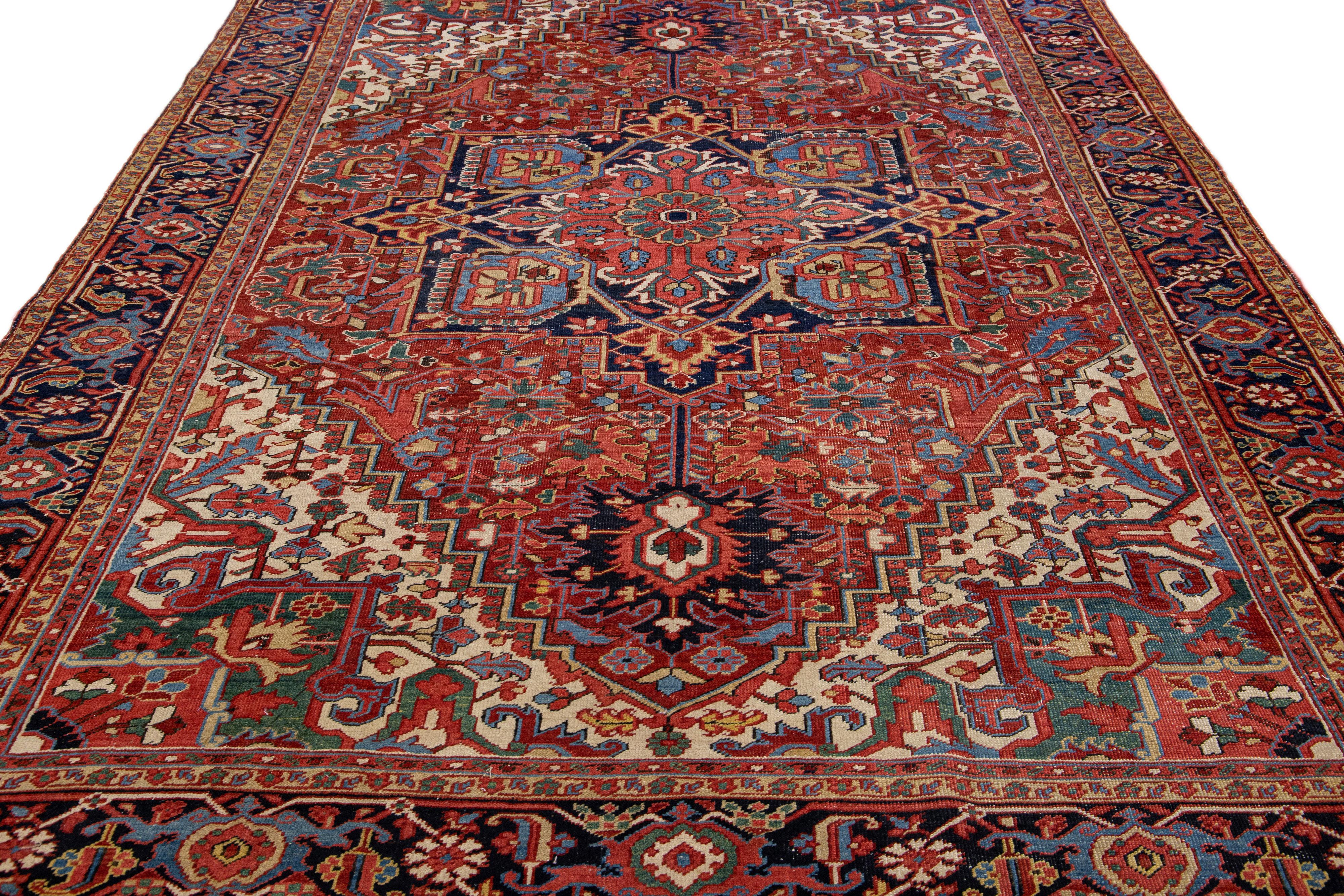 Heriz Serapi Antique Persian Heriz Red Handmade Wool Rug with Medallion Design For Sale