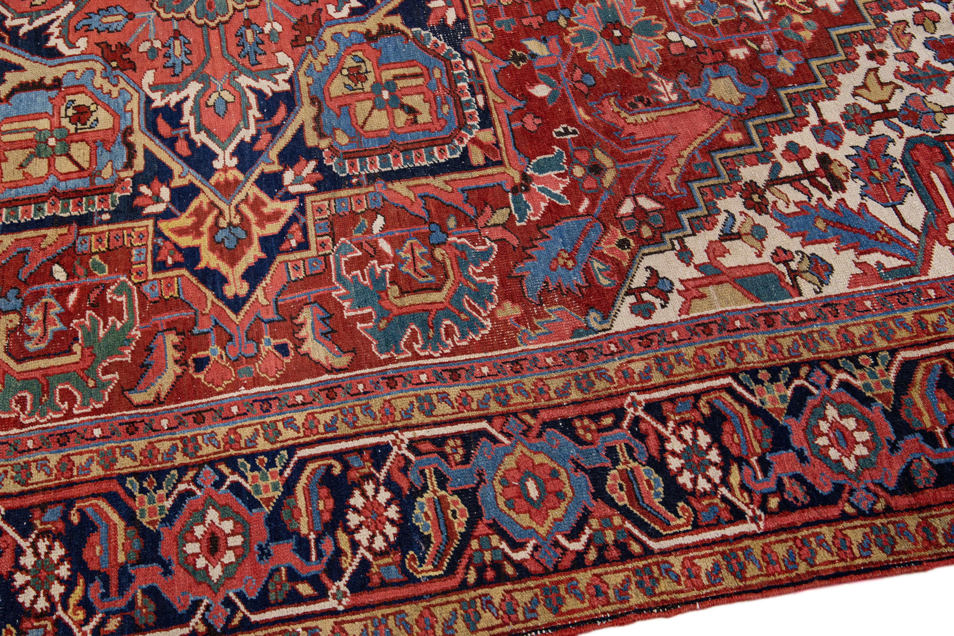 20th Century Antique Persian Heriz Red Handmade Wool Rug with Medallion Design For Sale