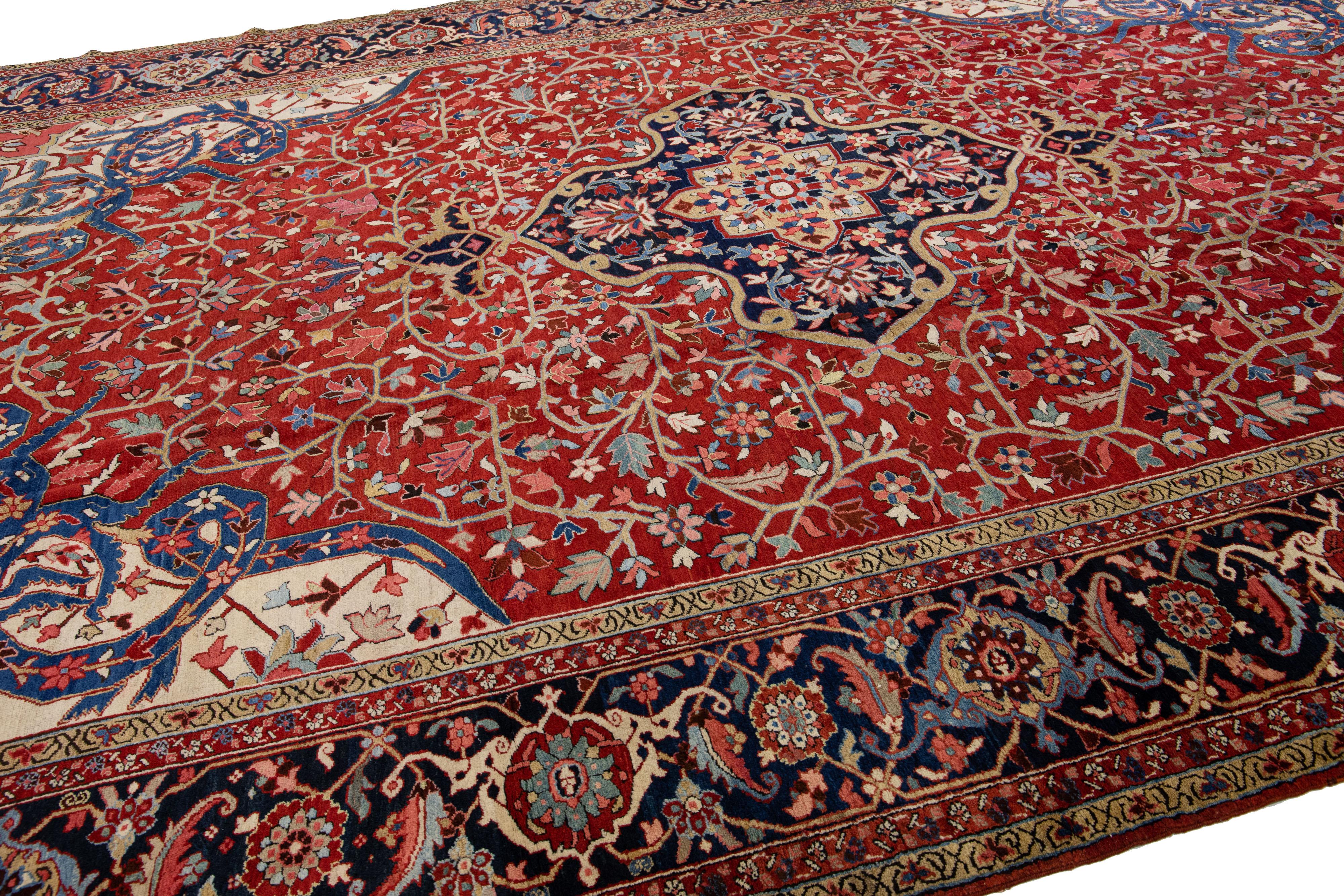 20th Century Antique Persian Heriz Red Handmade Wool Rug With Medallion Motif For Sale