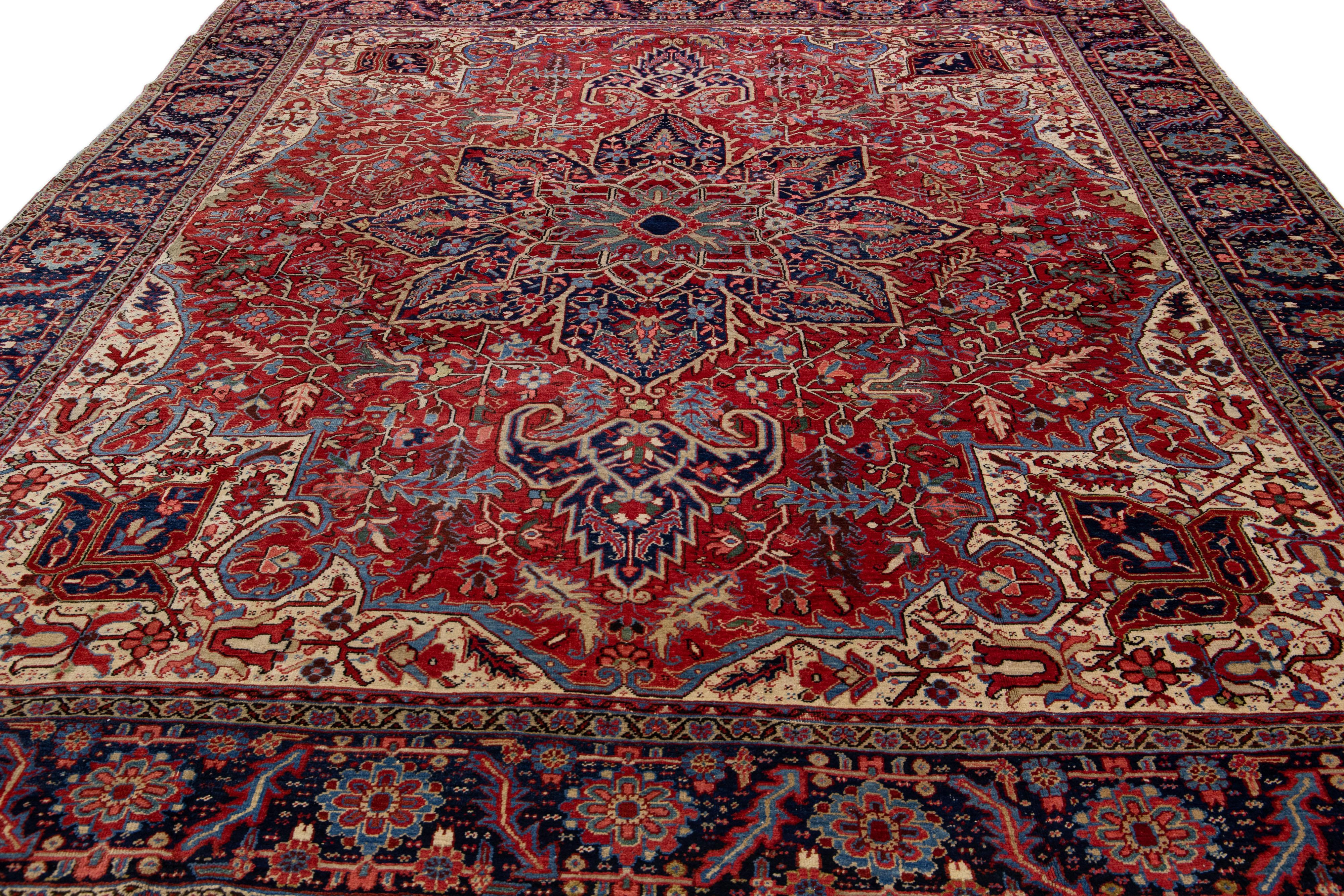 Heriz Serapi Antique Persian Heriz Red Handmade Wool Rug With Multicolor Medallion Motif For Sale