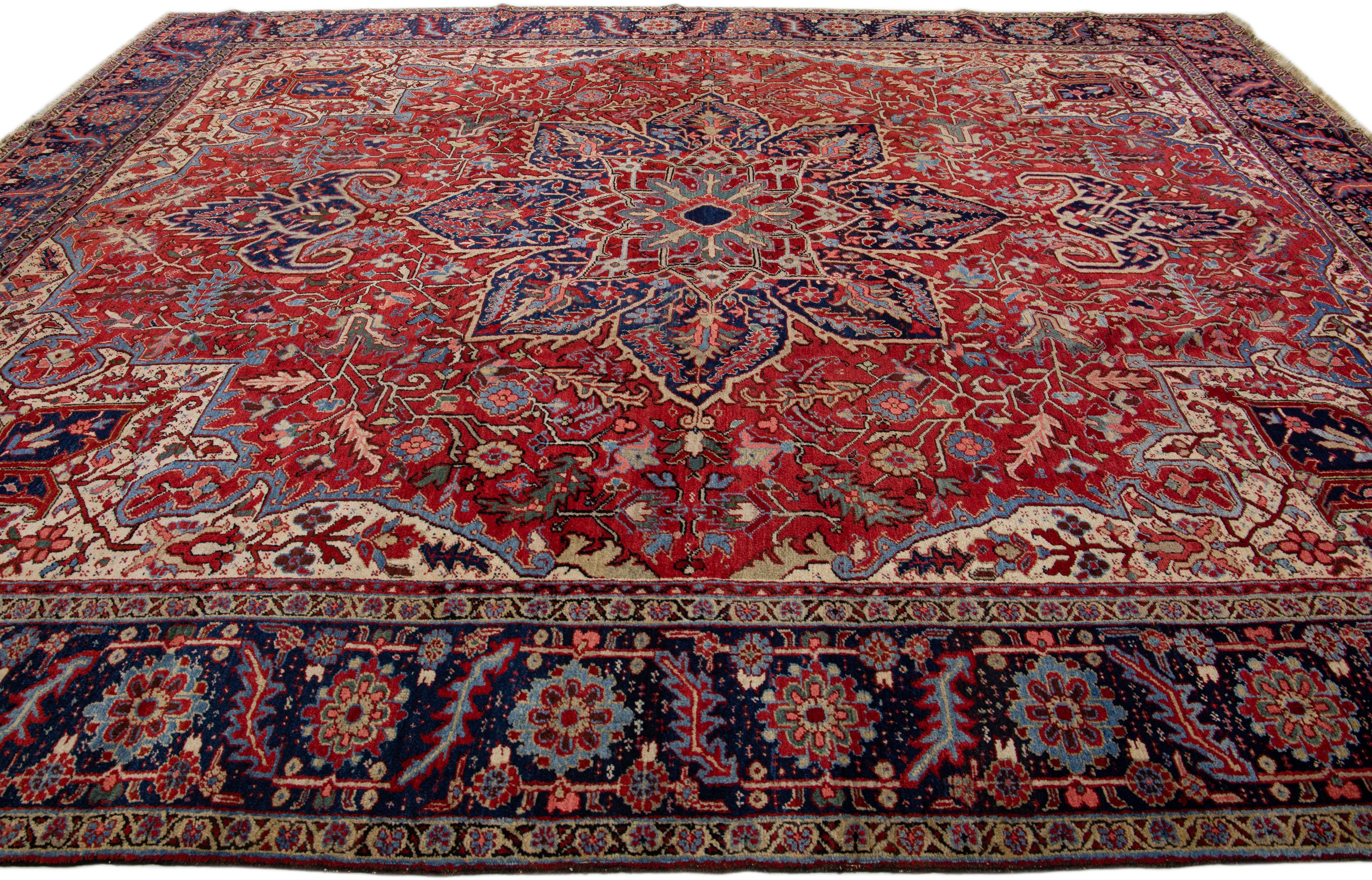 20th Century Antique Persian Heriz Red Handmade Wool Rug With Multicolor Medallion Motif For Sale