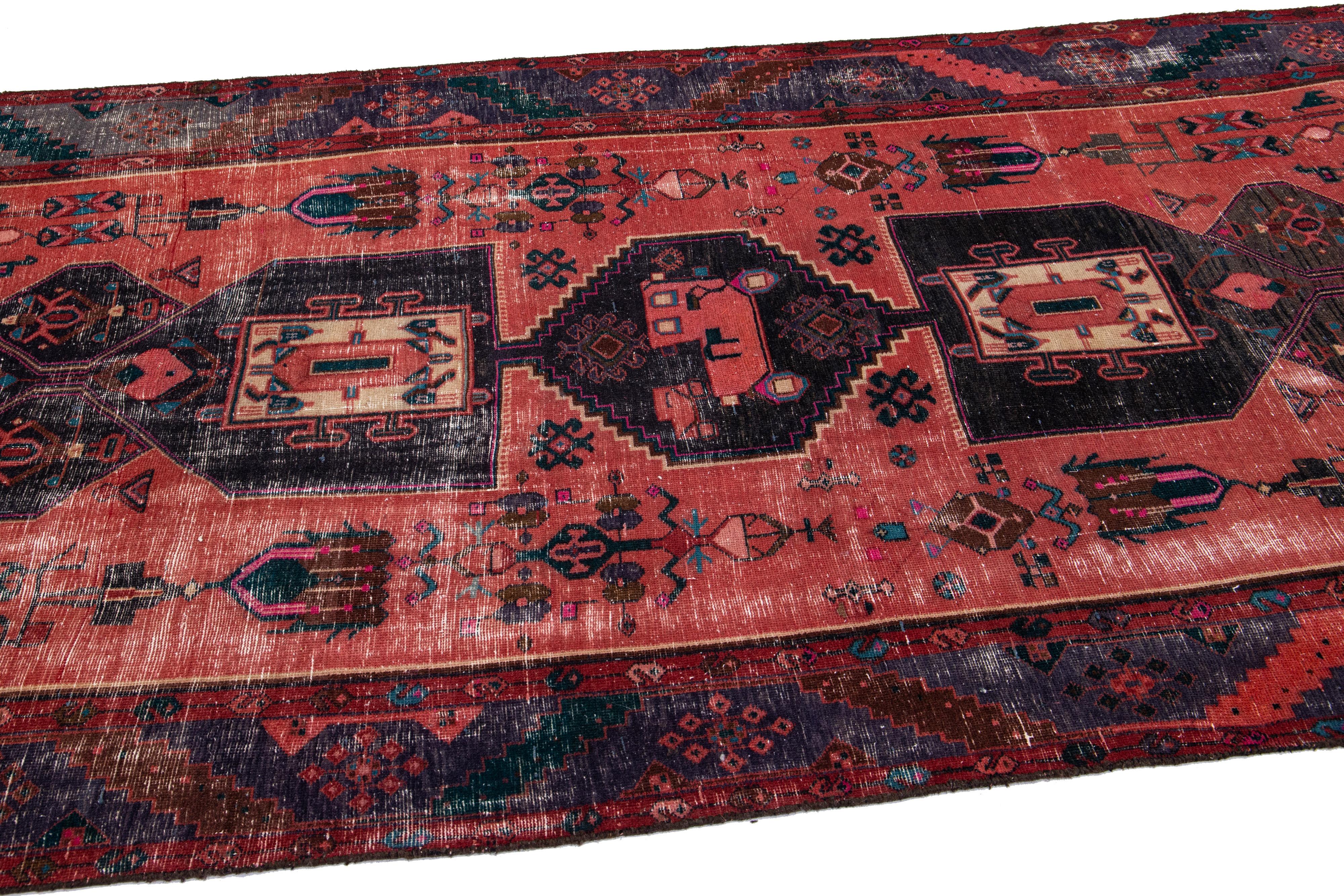 20th Century Antique Persian Heriz Red Handmade Wool Runner with Multicolor Tribal Design For Sale