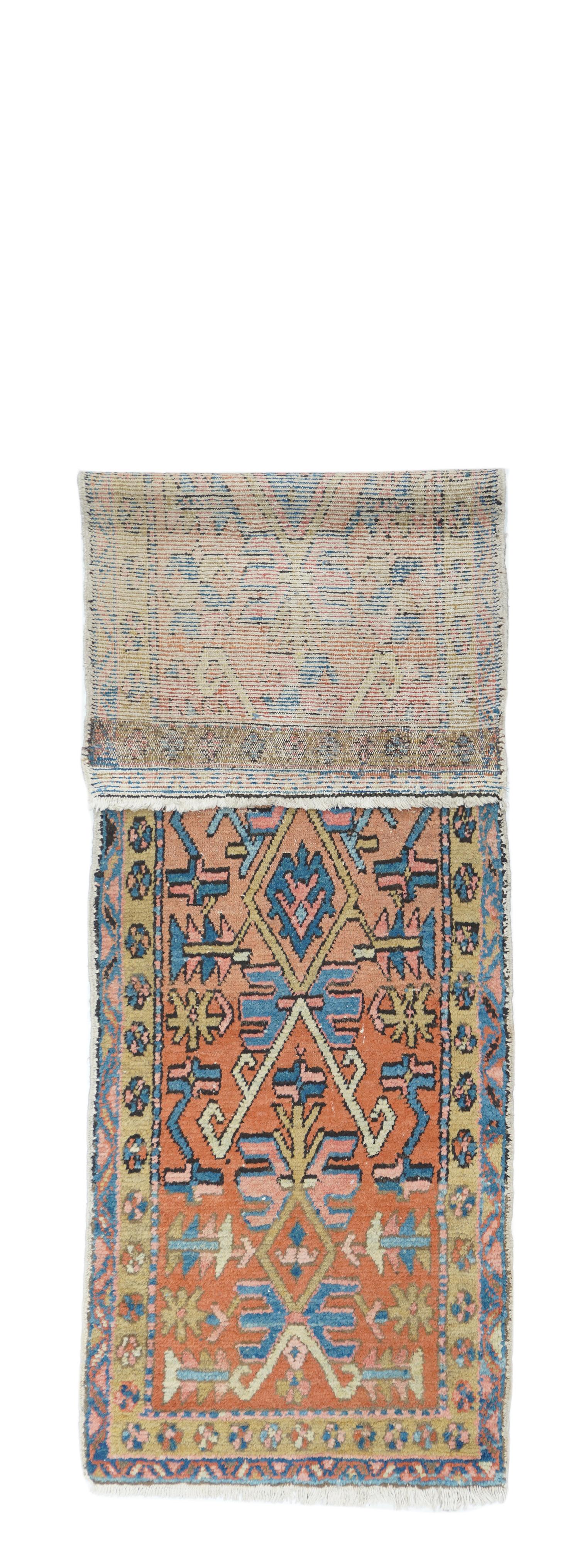 Probably Mishkin. This rather coarsely wove, cotton foundation, geometric pattern rustic runner (kenare) shows a  lozenge and inverted V pattern in ecru and straw on an abrashing  light rust to rusty-camel   ground.  Highlights in light blue, pale