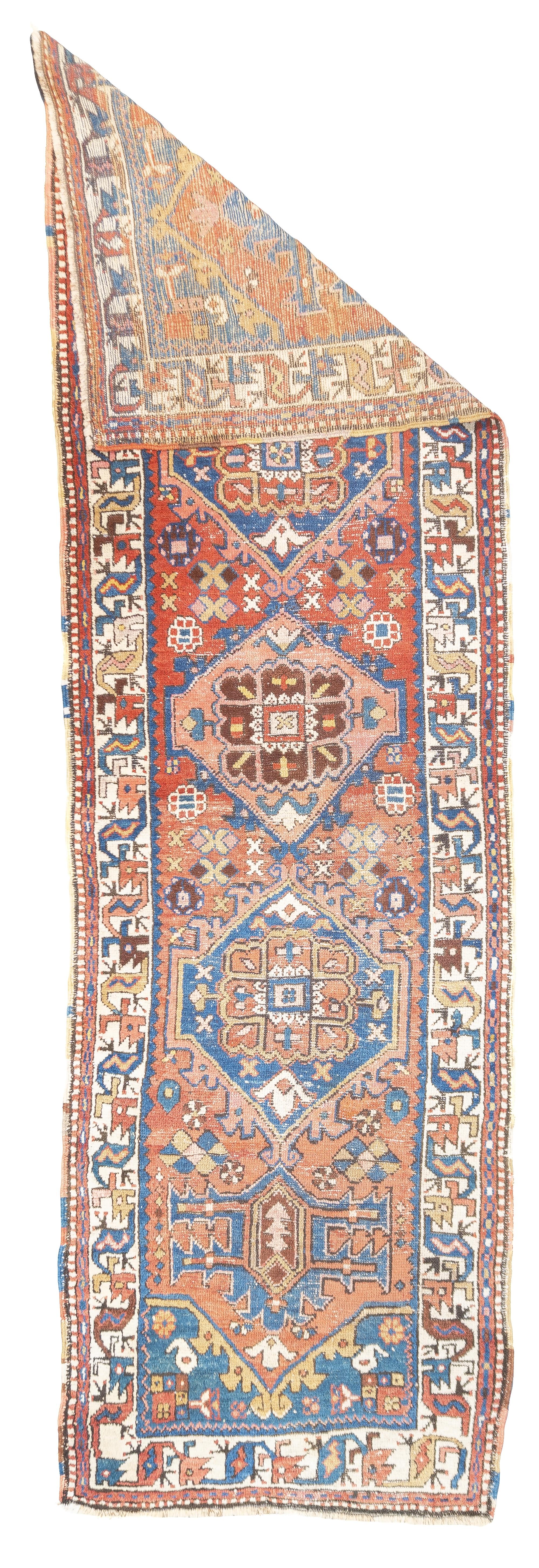 Antique Persian Heriz Rug 3'5'' x 10'1''. The numerous rugs of the famous NW Persian weaving district, from small scatters to giant carpets and a few runners, in semi-geometric medallion, centralised and strictly allover patterns, on cotton