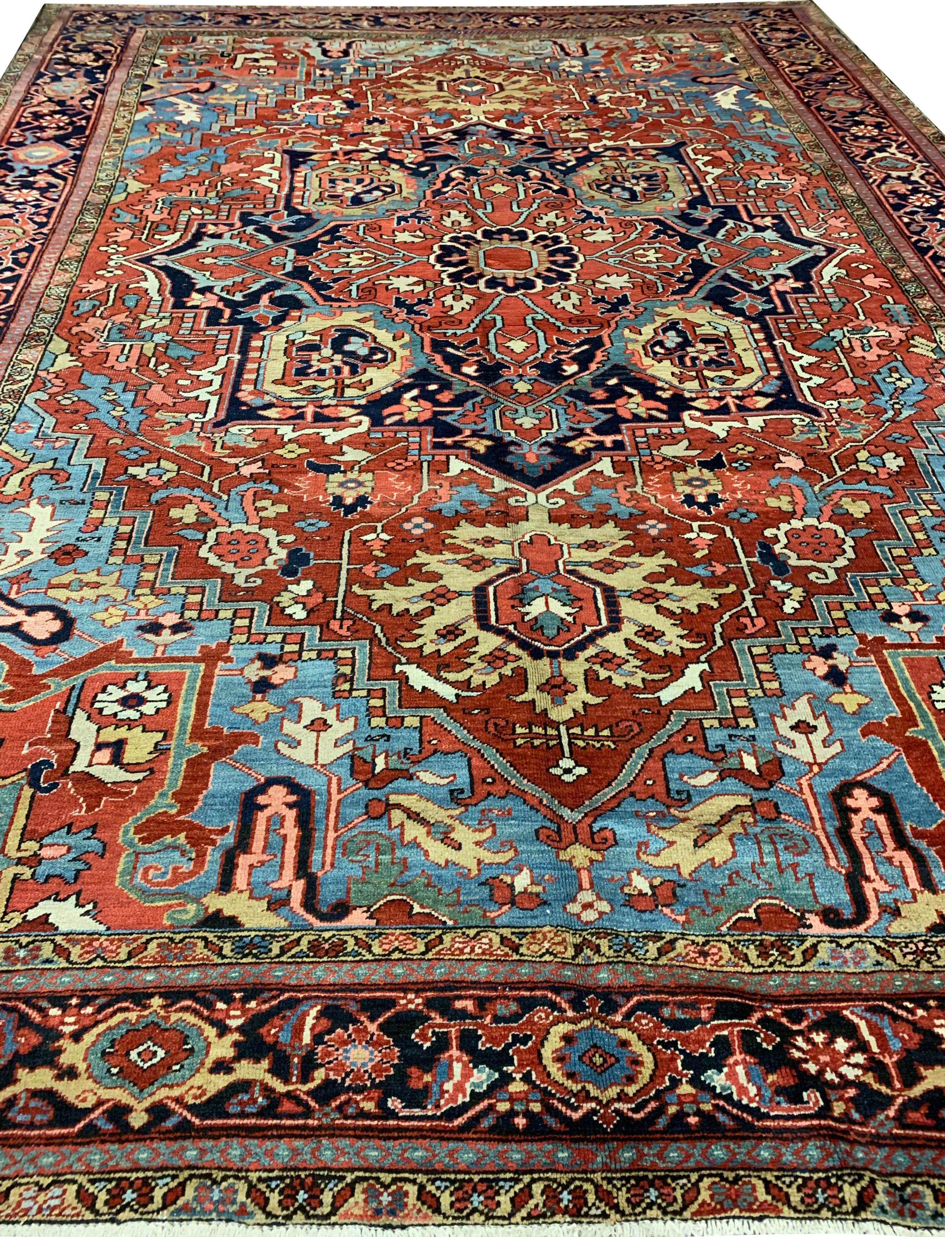 Antique Persian Heriz rug, 9'9 x 13'1. As perpetually fashionable as they are collectible, traditional Heriz rugs are skilfully woven in vibrant colors and emphatic geometric designs. This rug has a character all its own with the dark navy border