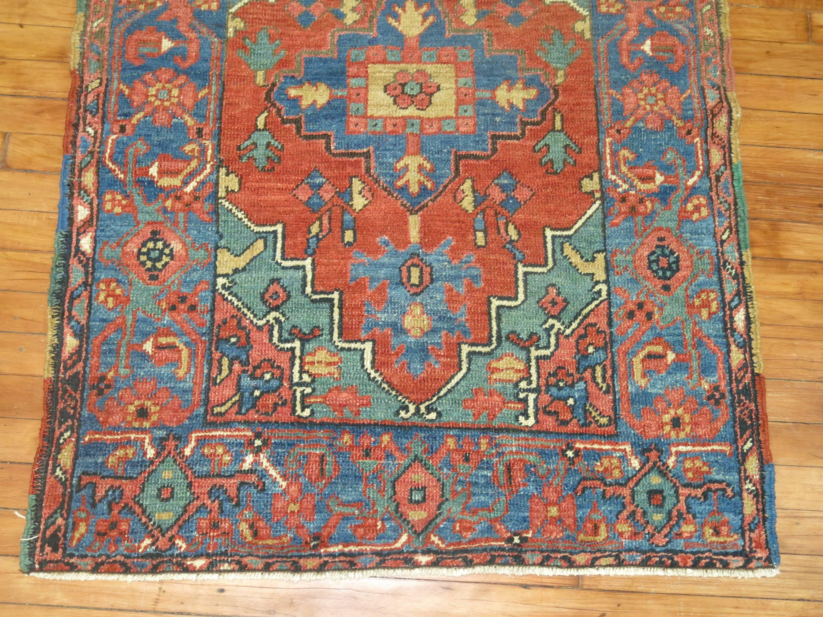 A colorful early 20th century Persian Heriz rug.