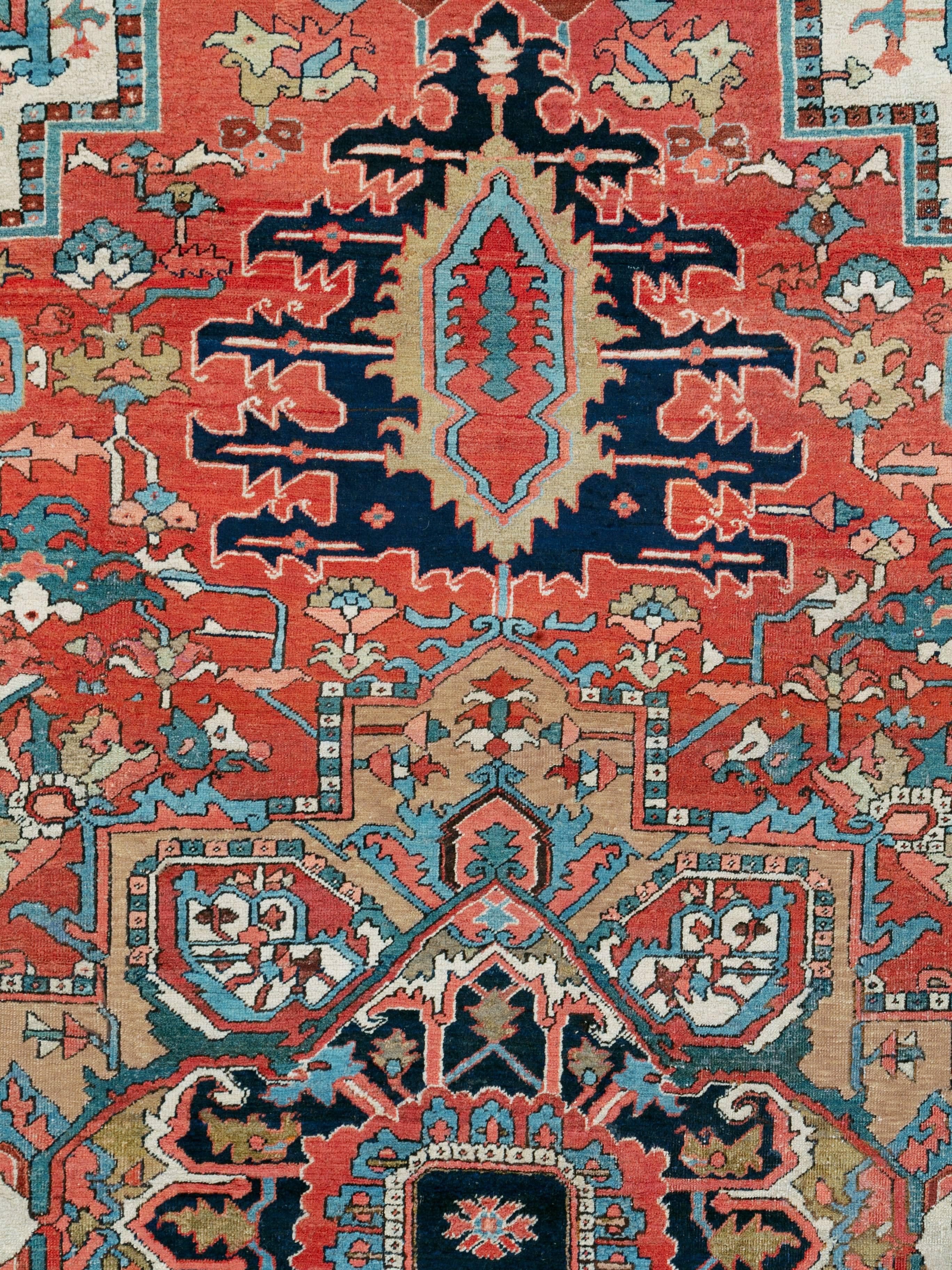 An antique Persian Heriz rug from the early 20th century.