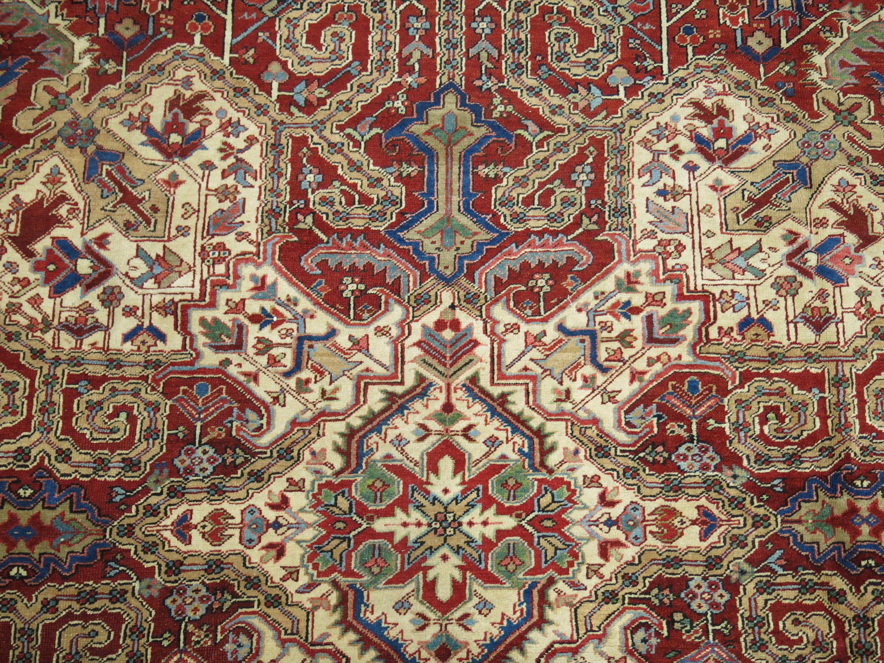 An early 20th century Persian Heriz rug Full Pile Condition featuring a dramatic medallion and large-scale design. Excellent Overall Condition.

11'9'' x 14'9''