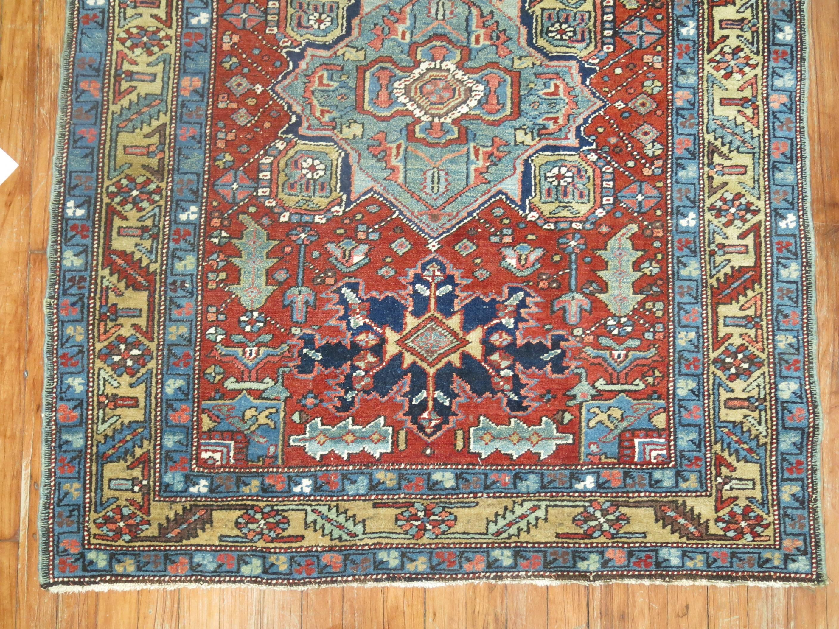 One of a kind throw square size antique Persian Heriz rug.