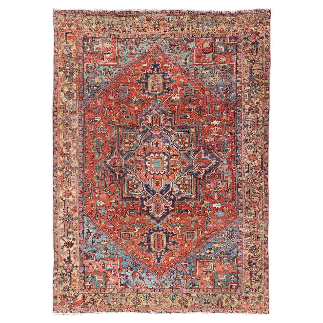 Tapis persan ancien Heriz en laine avec motif de médaillon géométrique dans les tons de bijoux