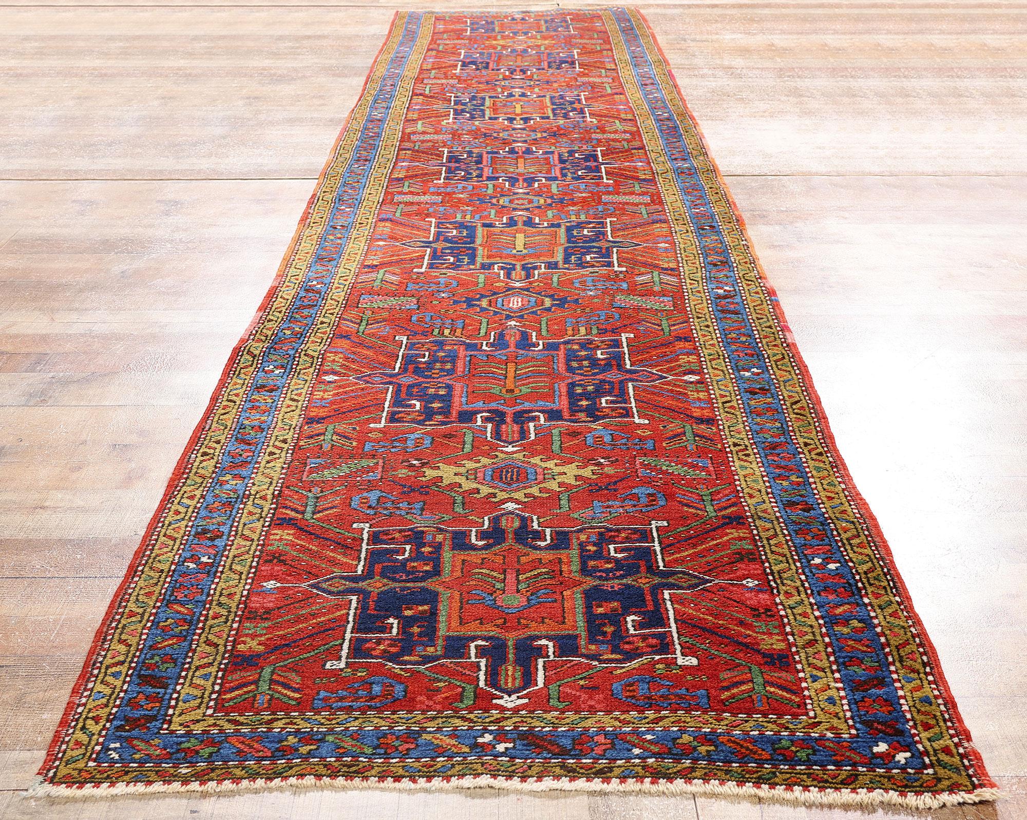79244 Antique Persian Heriz Rug Runner, 03'02 x 14'07. Bathed in rich heritage and visual grandeur, this hand knotted wool antique Persian Heriz rug runner is a masterpiece of tribal elegance and timeless artistry. Its striking red field sets the
