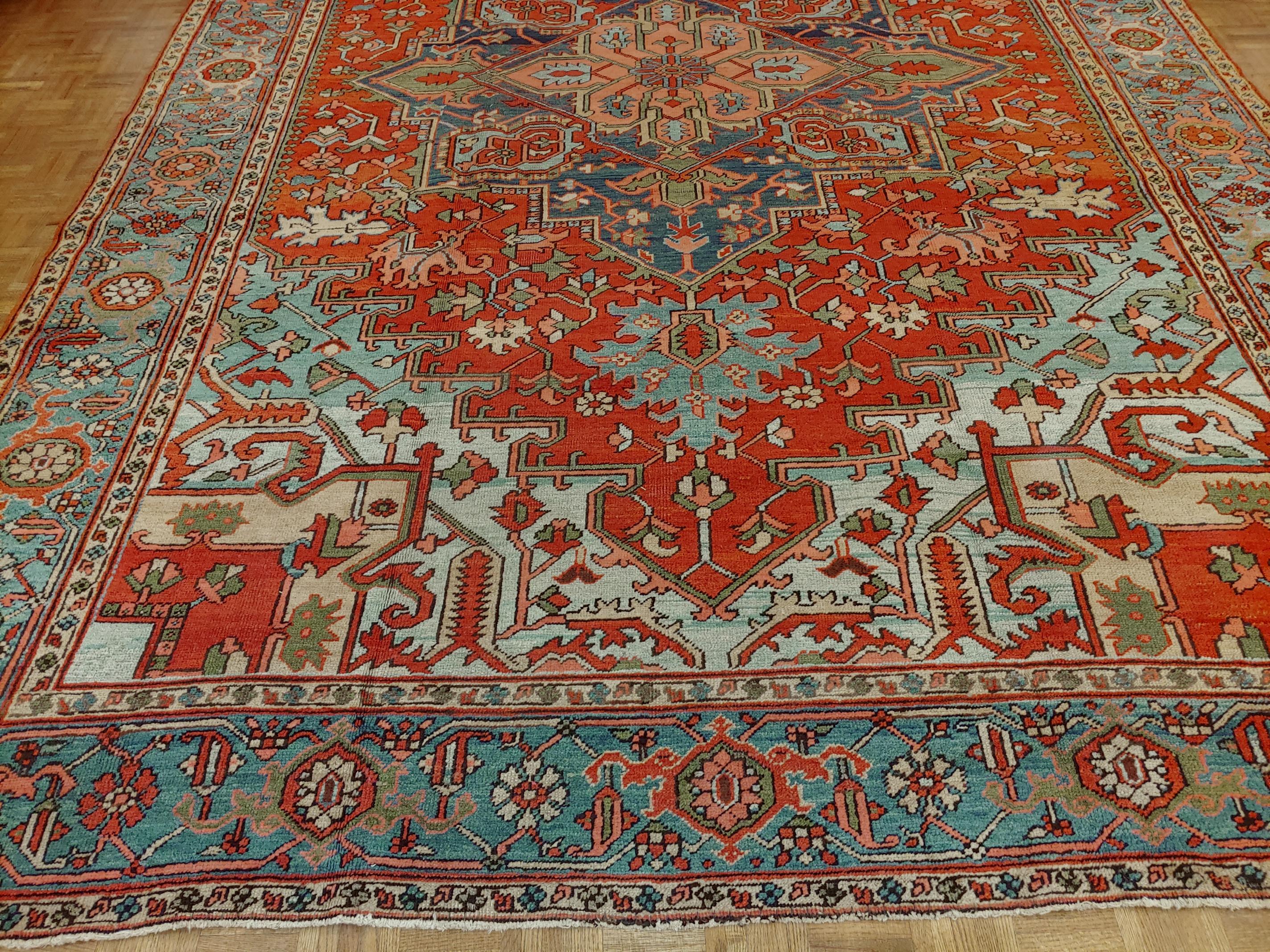 Great looking Persian antique Heriz with perfect harmony of design and colors rust field with glorious light blue spandrels and a light border with Classic geometric motif, circa 1910. Room size, size: 9 x 12-10.