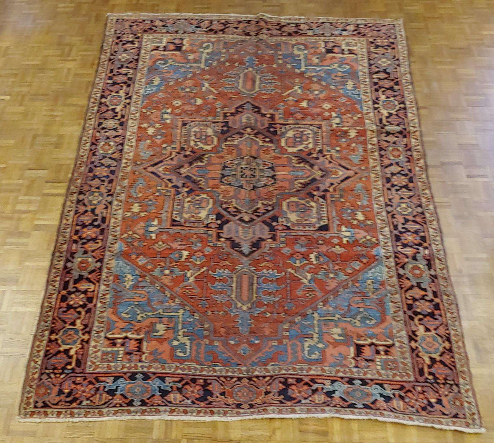 Woven Antique Persian Heriz Rug, Rust With Light Blue Corners, Wool, 1915 For Sale