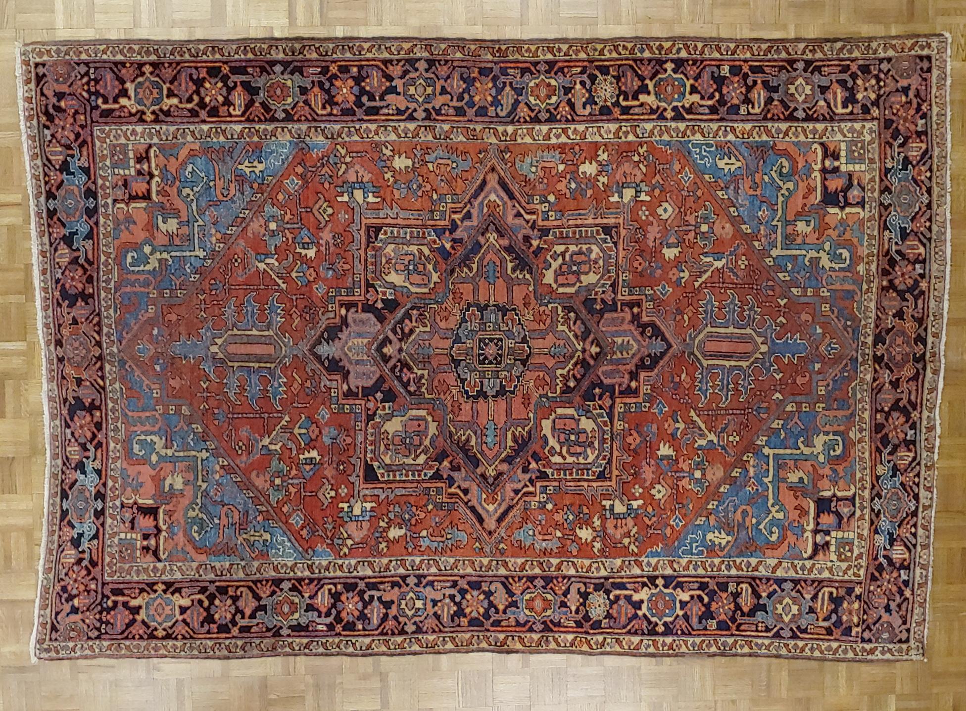 Antique Persian Heriz Rug, Rust With Light Blue Corners, Wool, 1915 In Good Condition For Sale In Williamsburg, VA