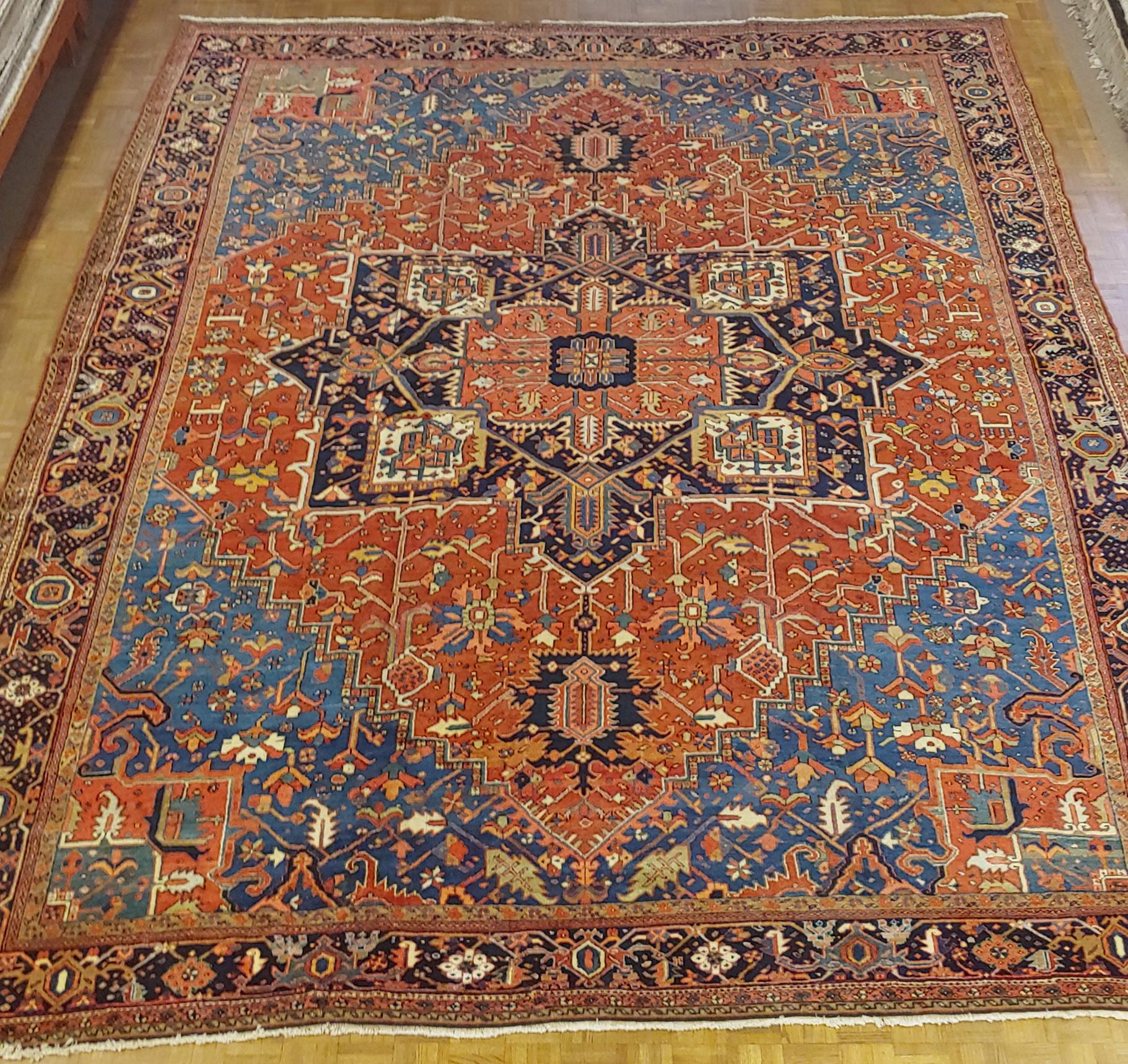 Great looking antique Persian Heriz, that some would call Serapi, from Northwest Persia. This rug has great harmony of design and colors with rust field with light blue spandrels that also use a beautiful teal color. It has a navy border with
